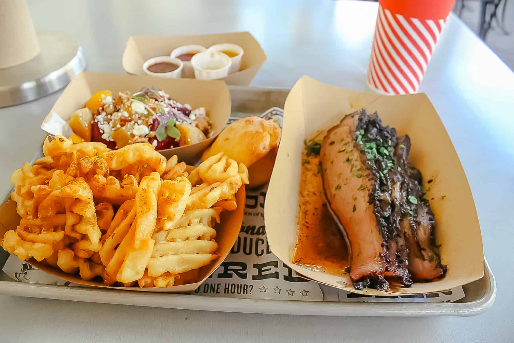 a platter of barbecue from The Polite Pig at Disney Springs 