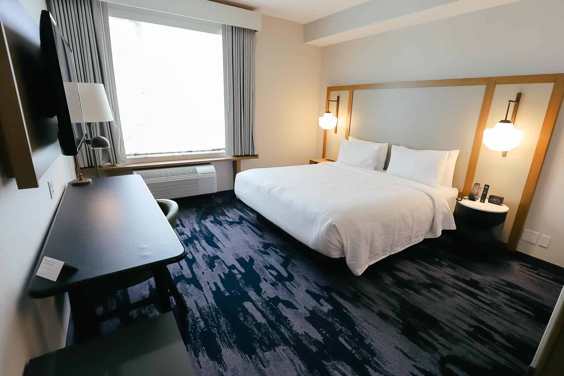 a room with a king size bed at Marriott near Disney World 