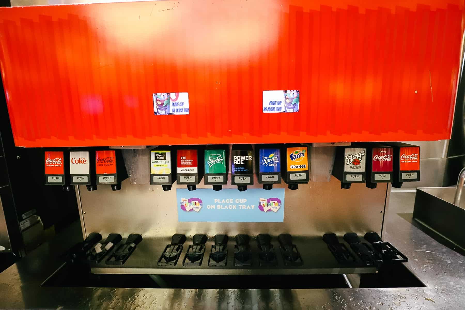 a soda fountain with Coca Cola products at Landscape of Flavors 