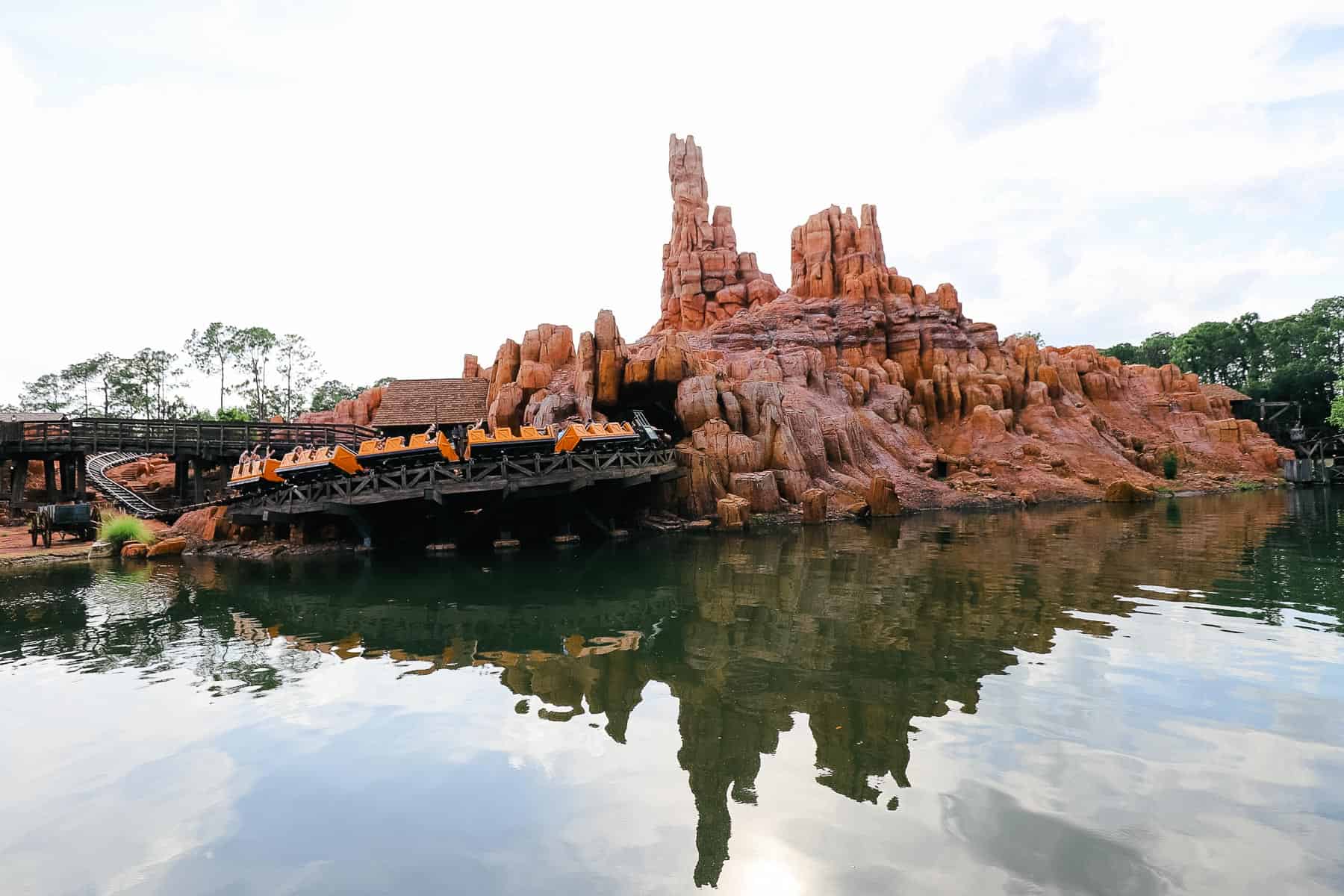 Big Thunder Mountain railroad car racing over the Rivers of America at Magic Kingdom. 