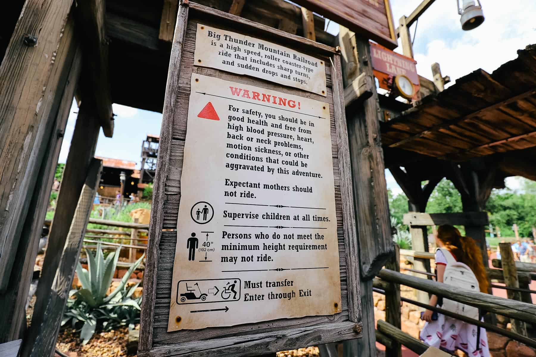 Warning sign that lists who shouldn't ride Big Thunder Mountain Railroad at Disney World