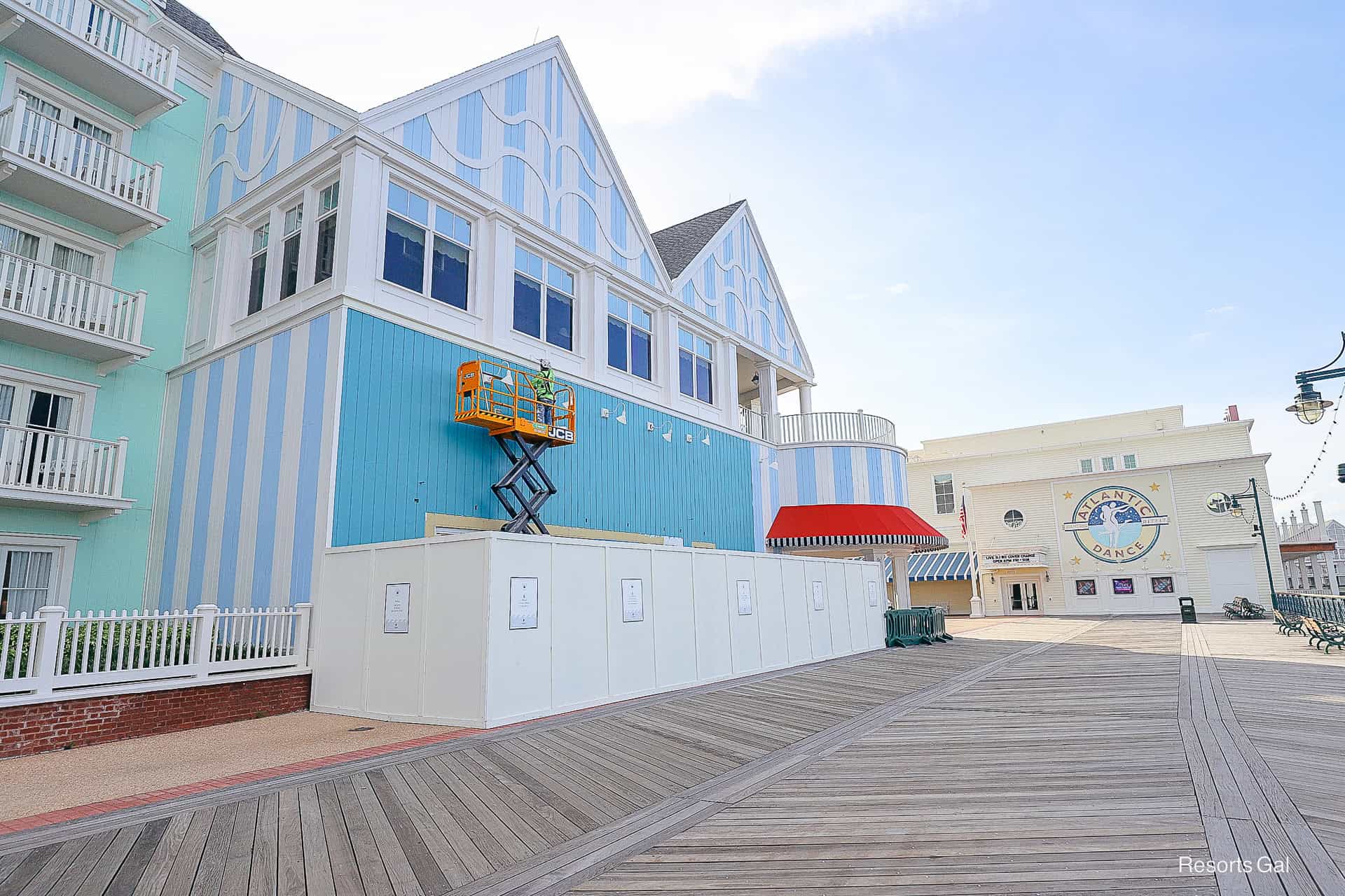 a construction worker painting a building on the Boardwalk