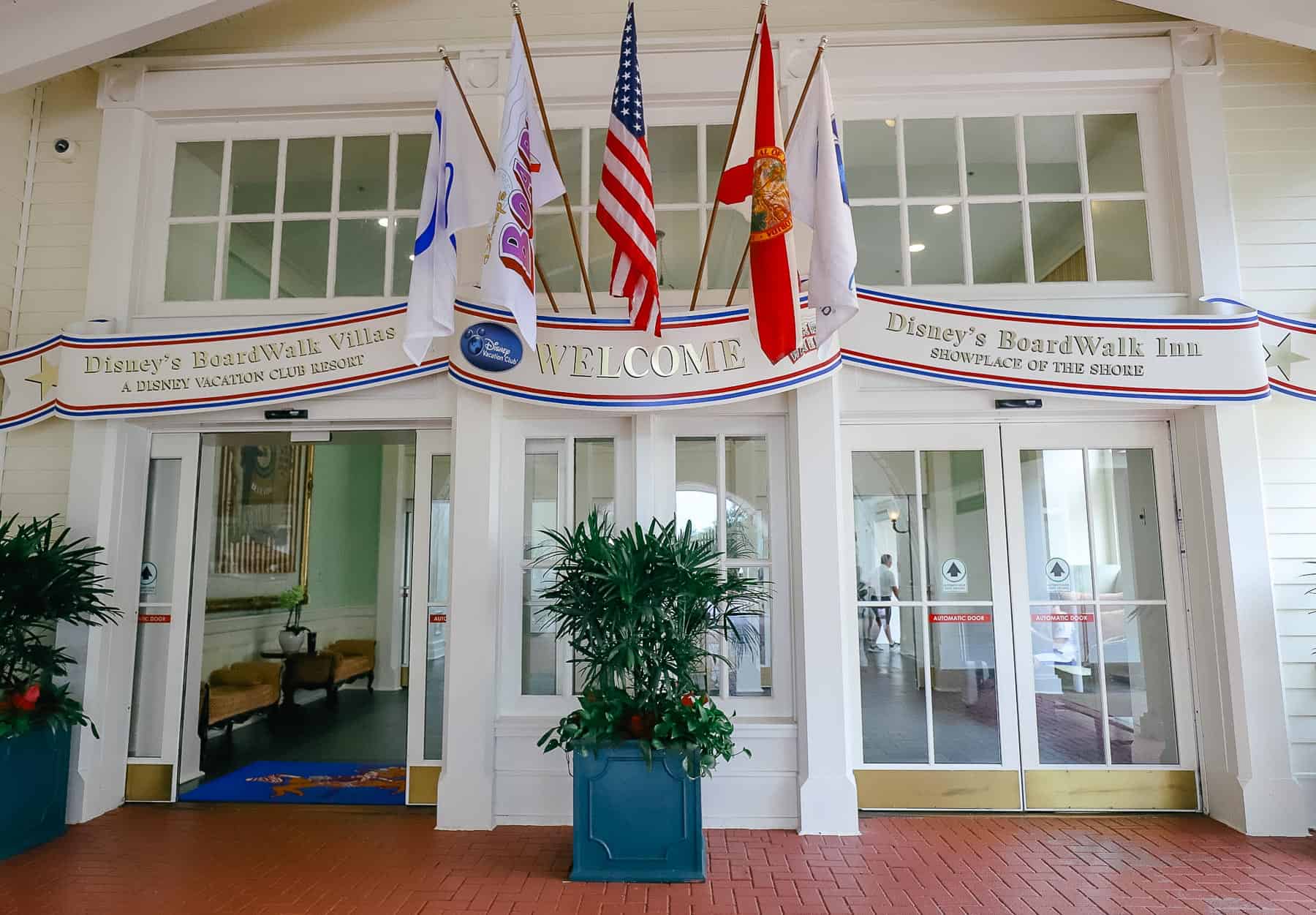 the entrance with the Boardwalk Inn sign on the right door and the Boardwalk Villas sign on the left 