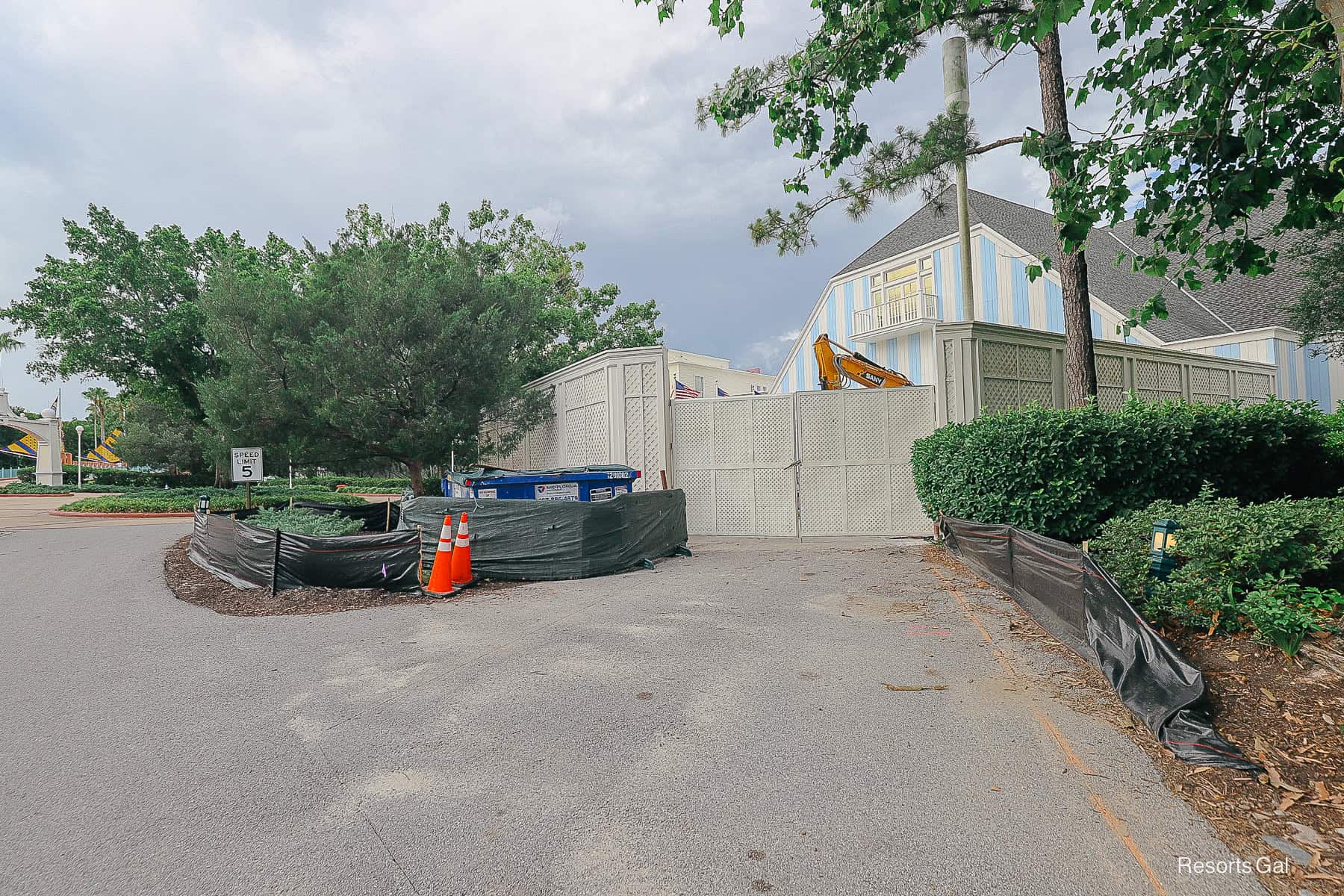 a fenced ared with a dumpster for debris 