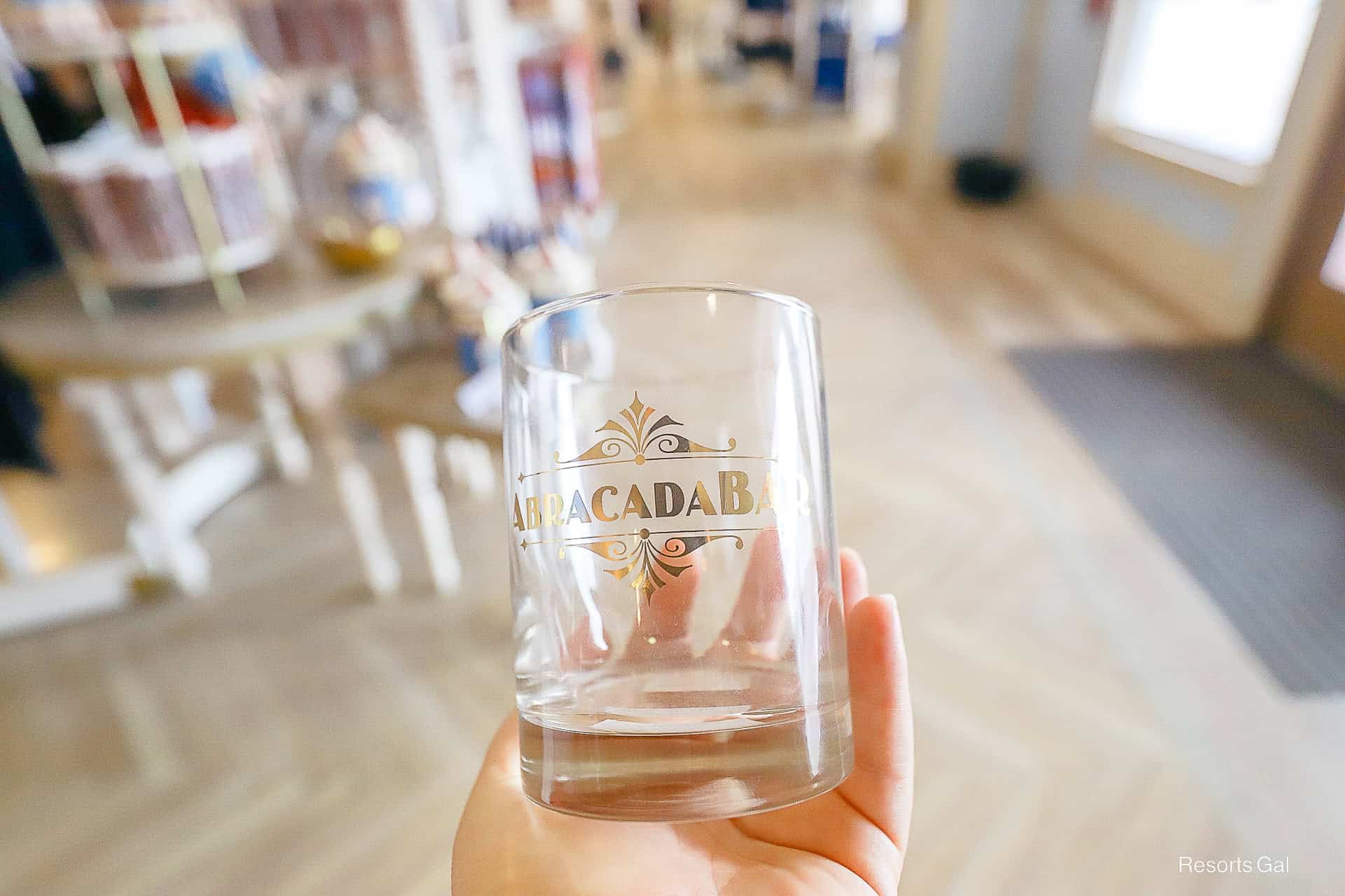 Abracadabar glass with gold logo