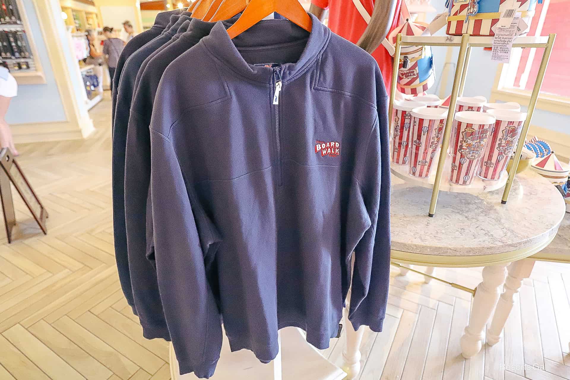 a navy blue pullover with the Boardwalk's logo