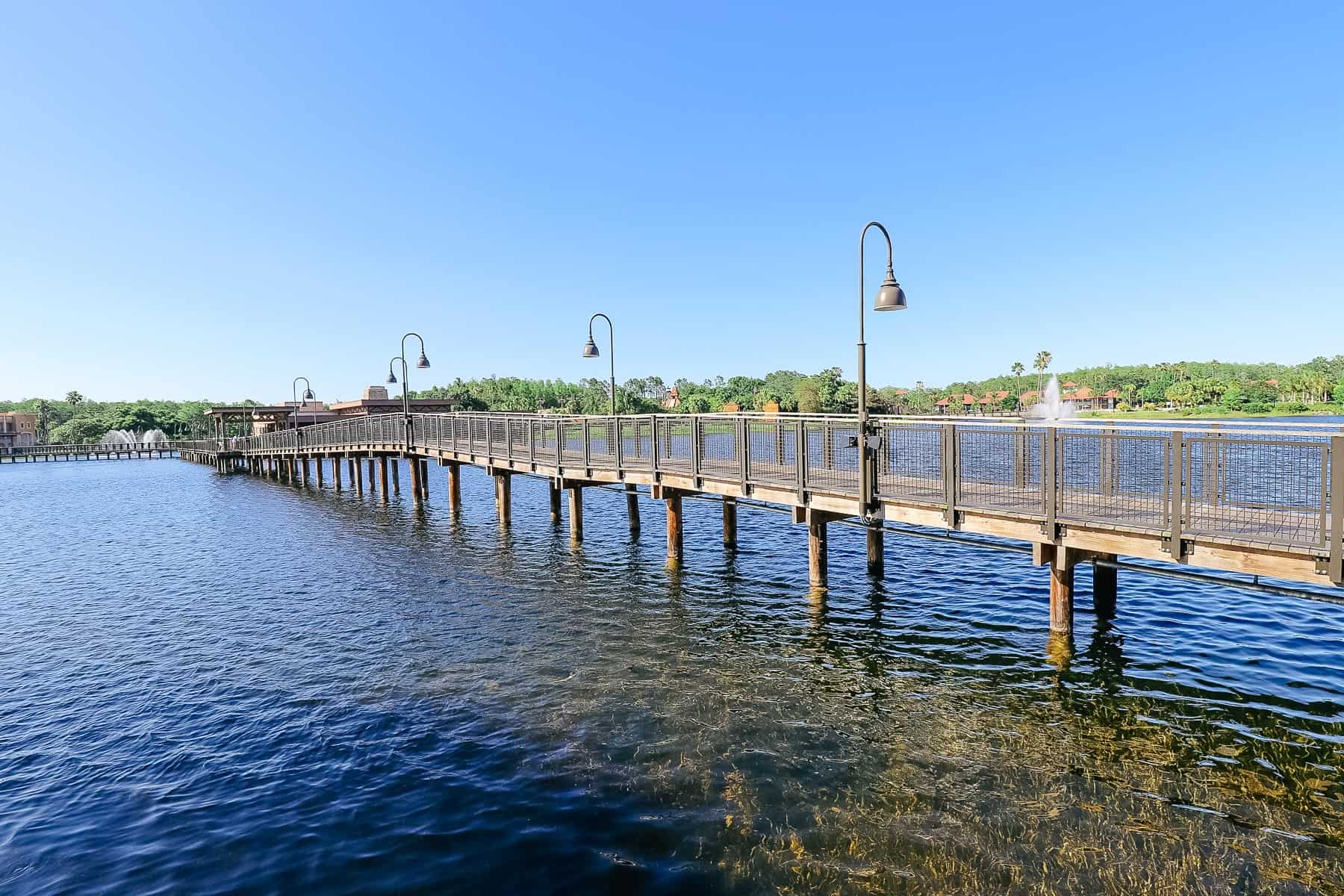 a bridge that allows guests to take a shortcut over the lake at Gran Destino Tower 