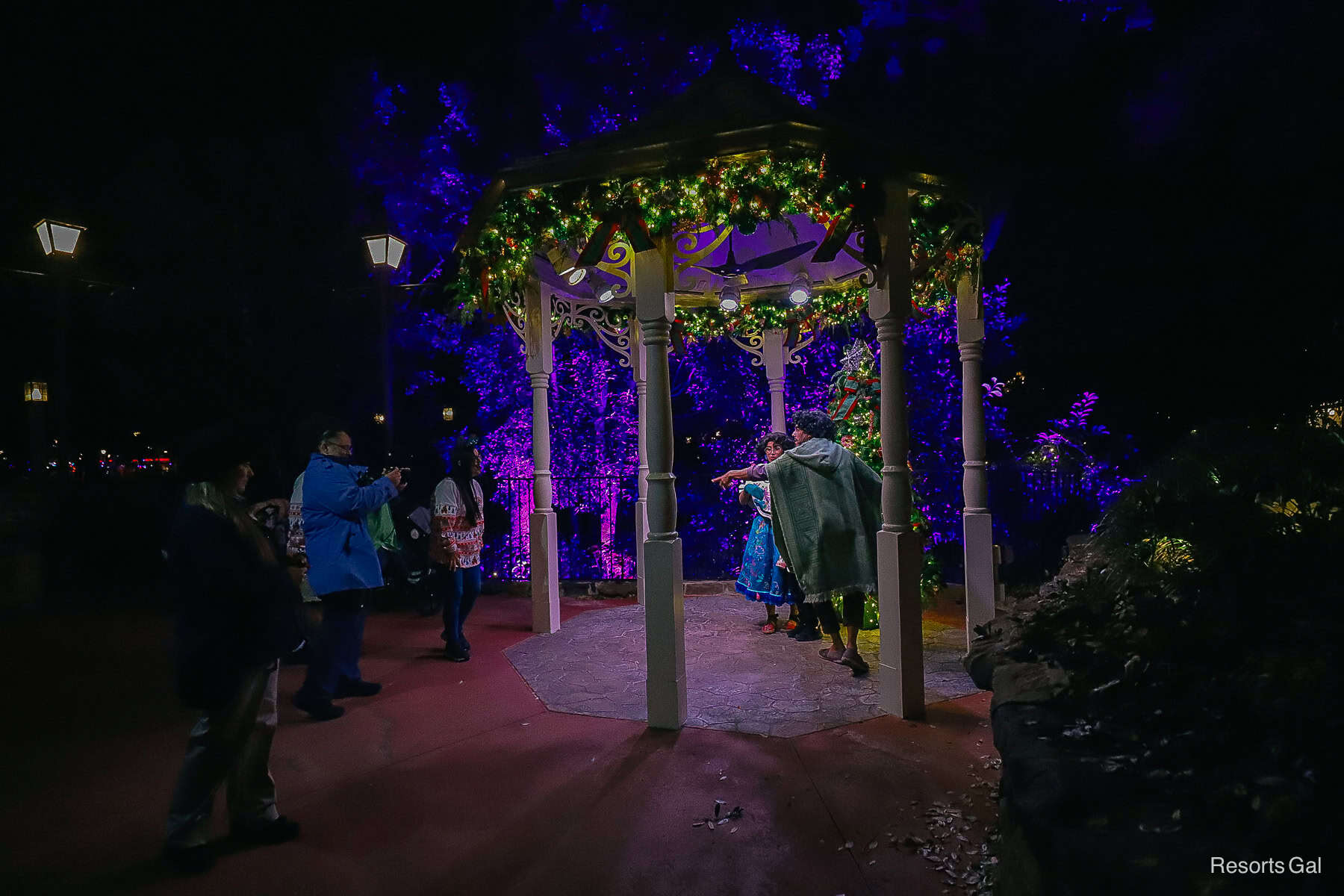 Bruno and Mirabel talk to guests in the Enchanted Glade Gazebo in Liberty Square