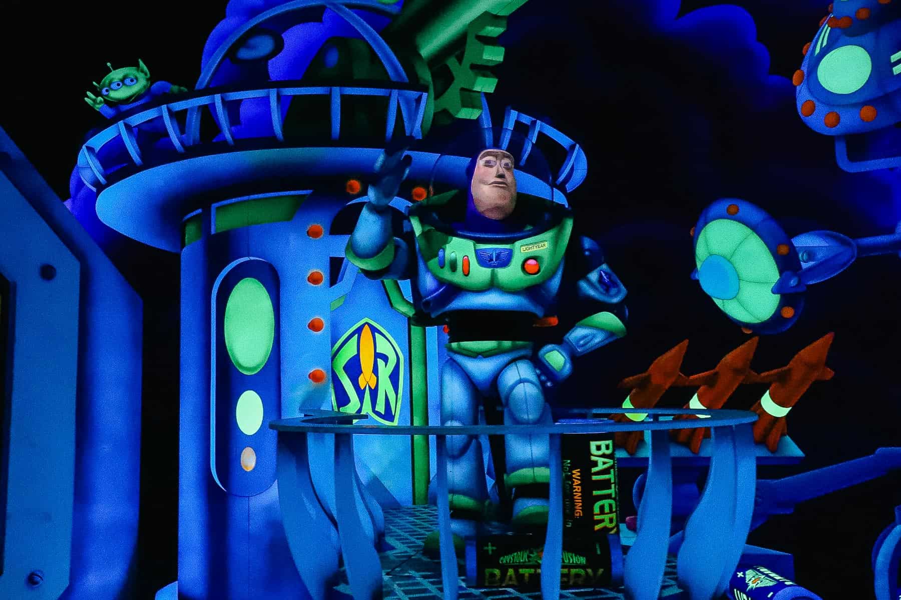 Buzz Lightyear salutes guests riding Space Ranger Spin. 