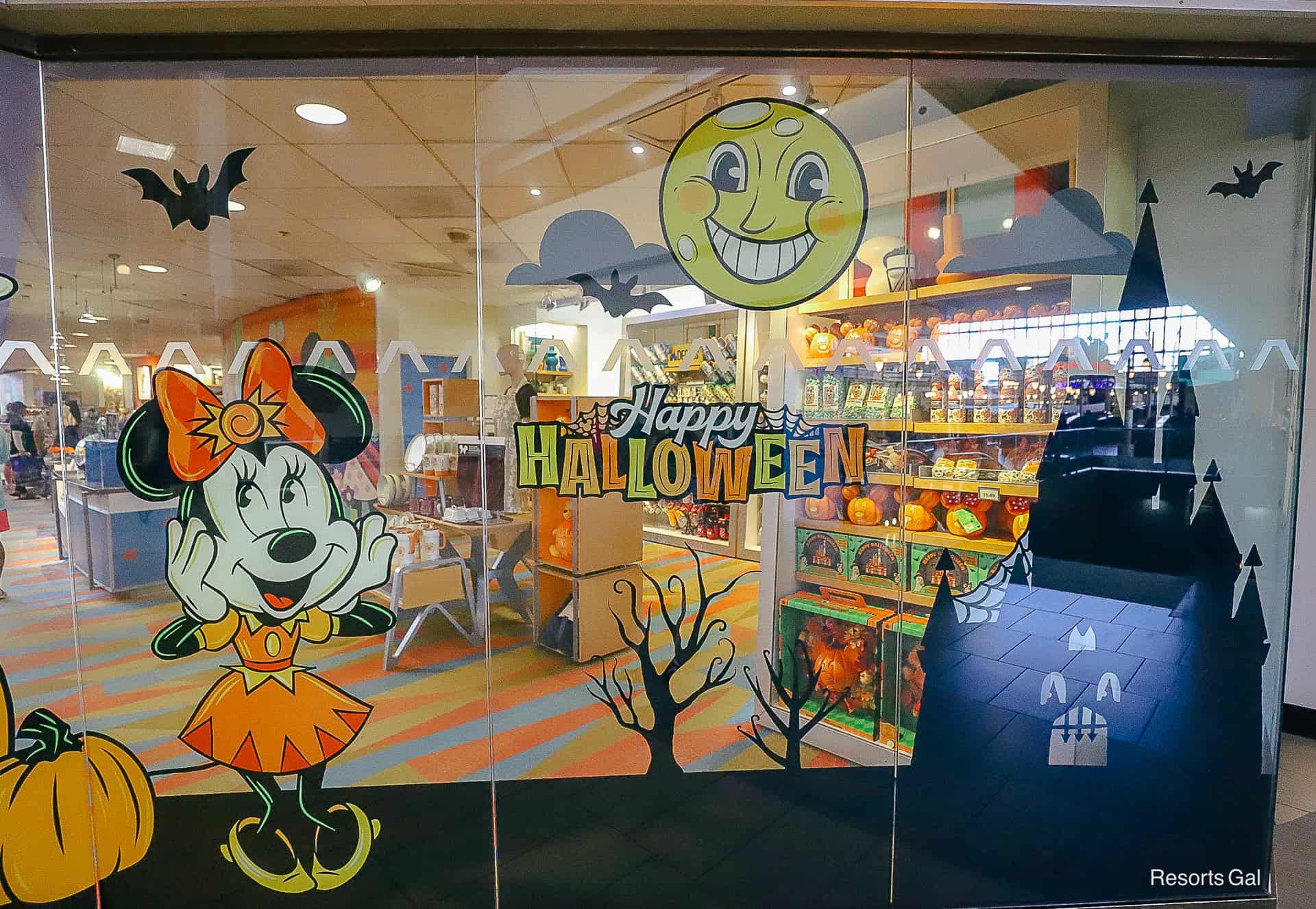 a closeup of the Halloween window display that features Minnie Mouse and a smiling moon
