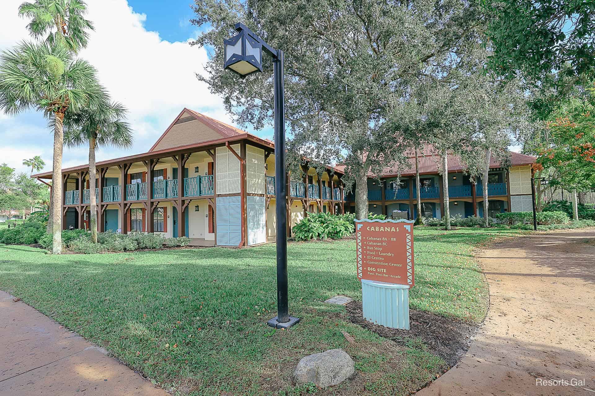 Cabanas building with a directional sign in front of it 
