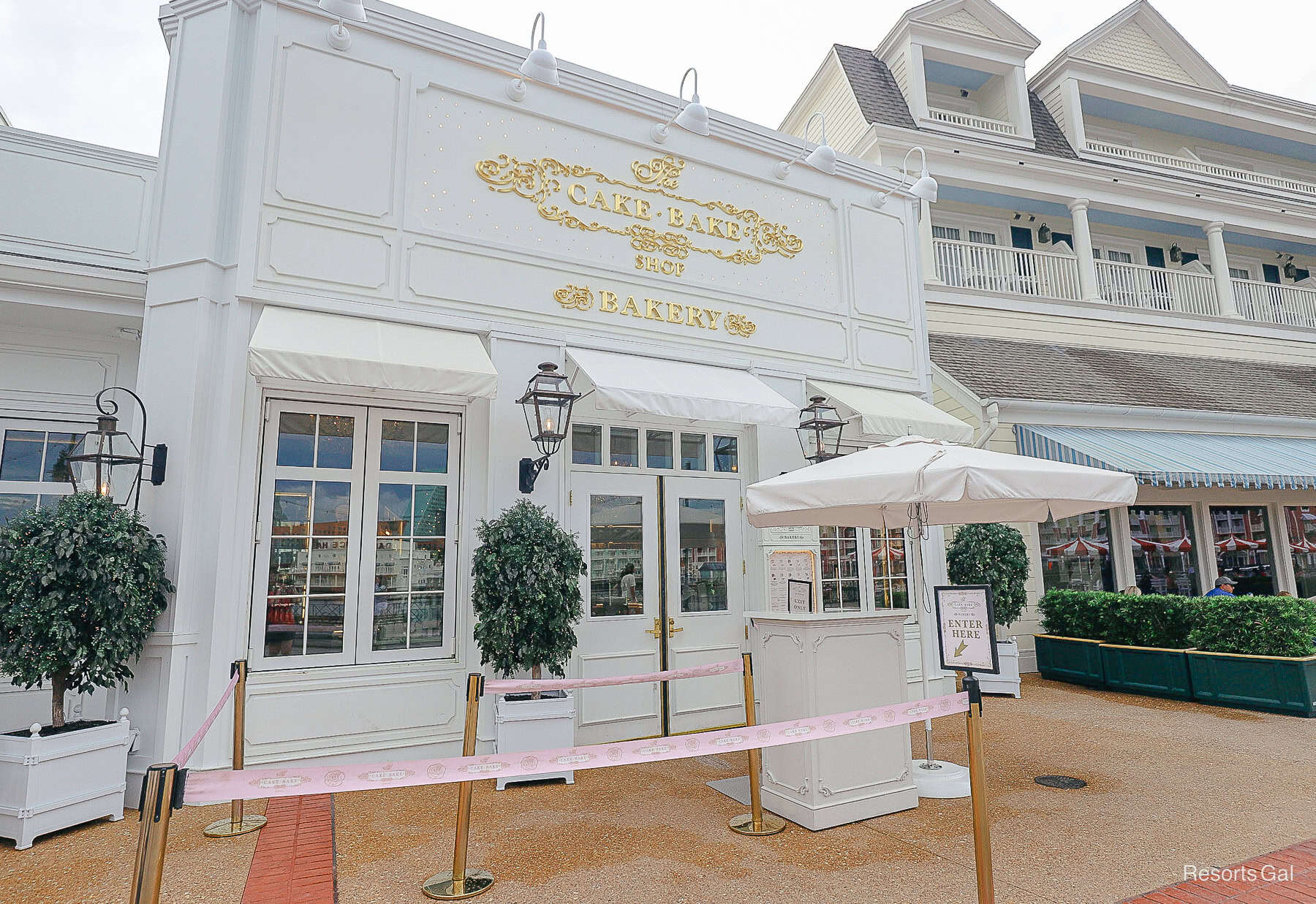 the exterior of the Bakery at the Cake Bake Shop with a pink satin rope stanchion