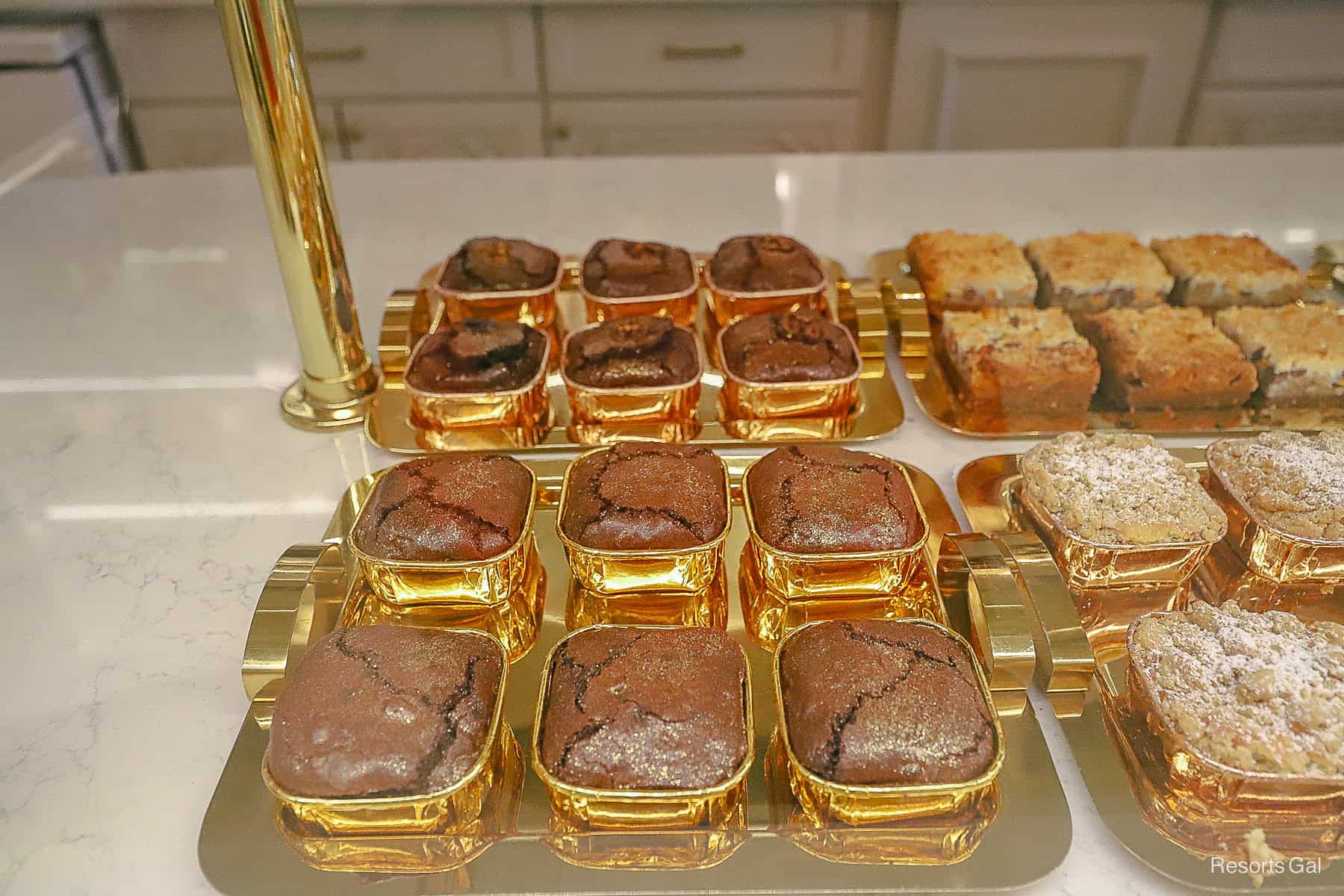 a closeup of the brownies in gold tins 