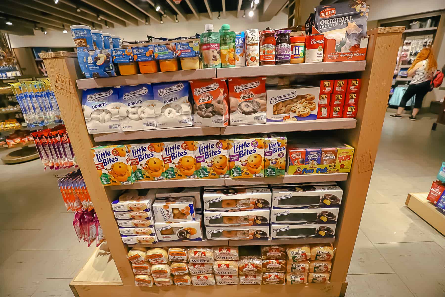 a display with donuts, muffines, baby food, condiments, and other pantry style items that guests might enjoy in their rooms at Calypso Trading Post 