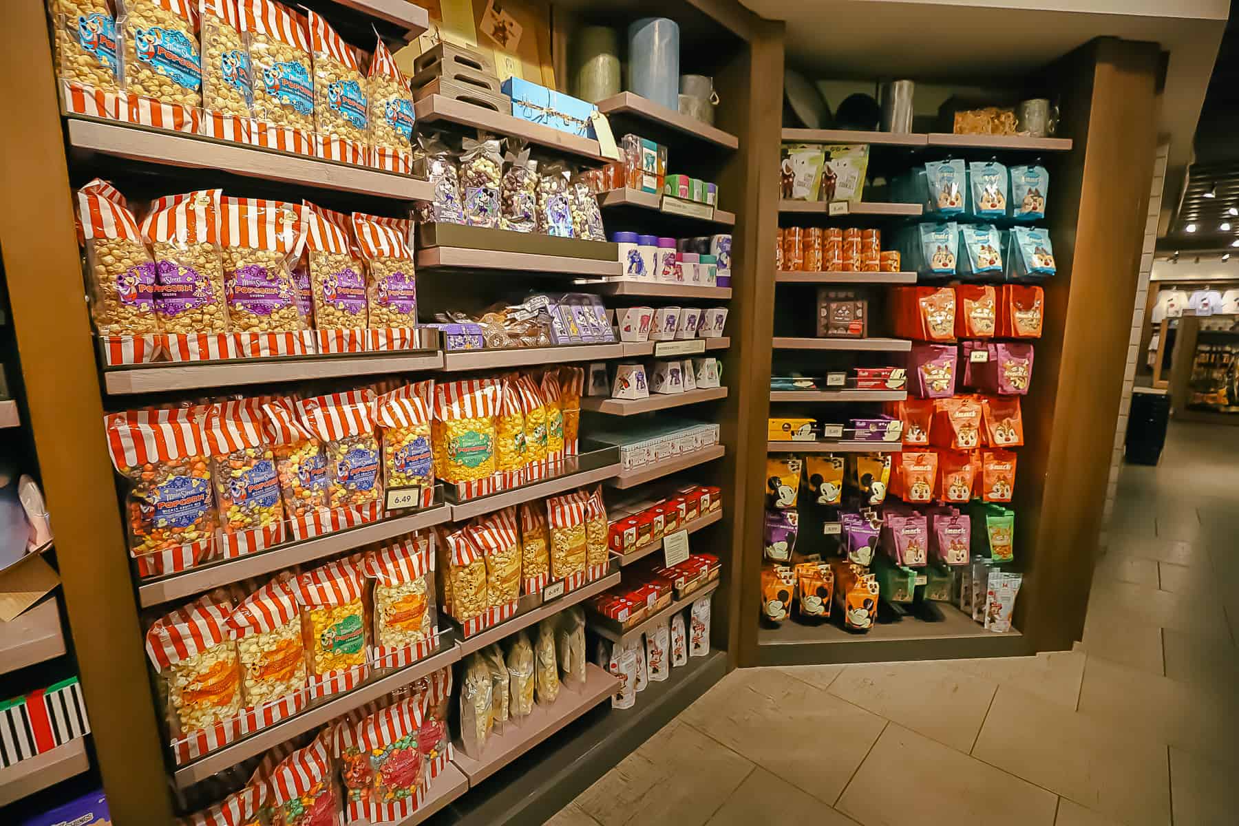 a display with Disney-branded popcorn and other snack items in Caribbean Beach Gift Shop 