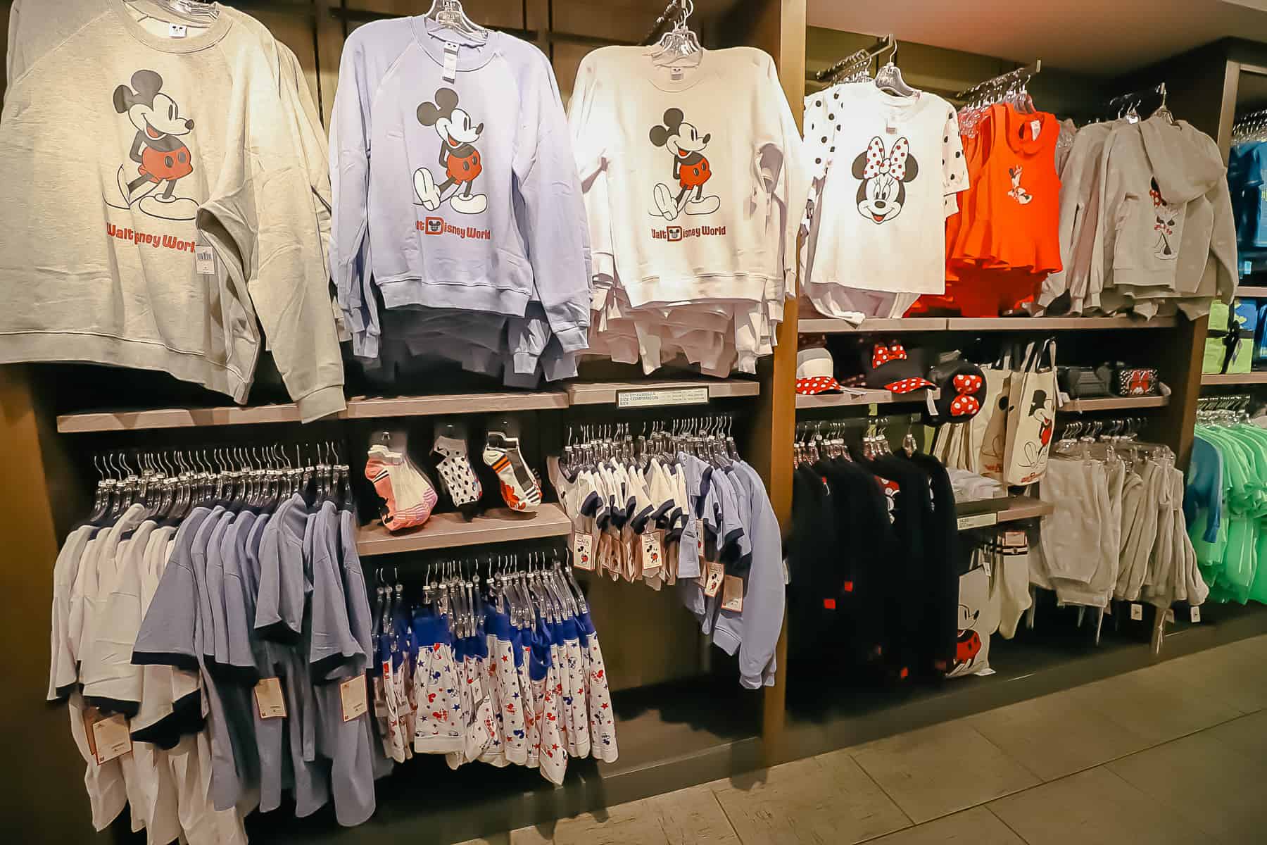 Mickey and Minnie Mouse apparel like sweat shirts, t-shirts, socks, and accessories in Calypso Trading Post 