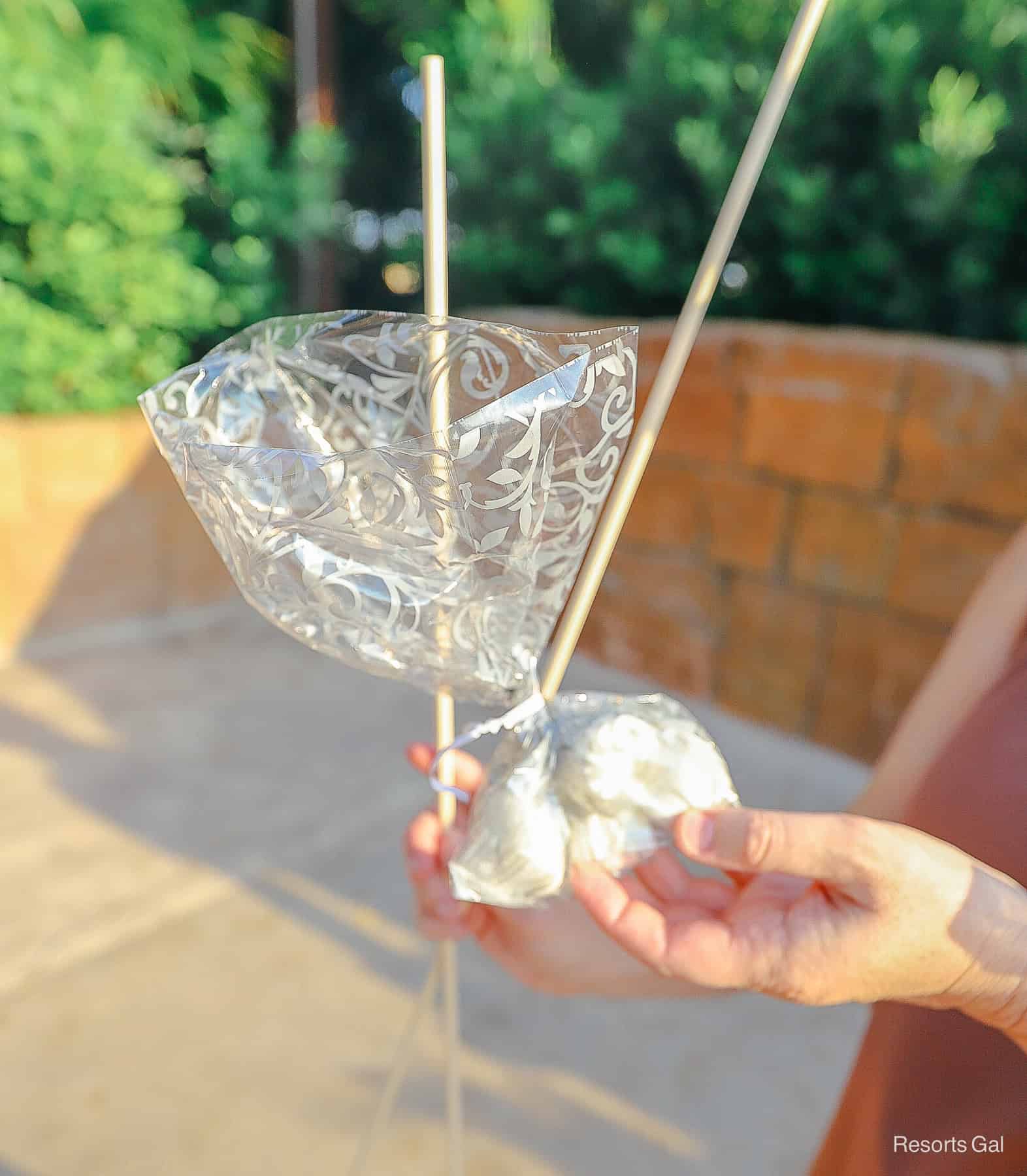 a package of complimentary marshmallows with two skewers