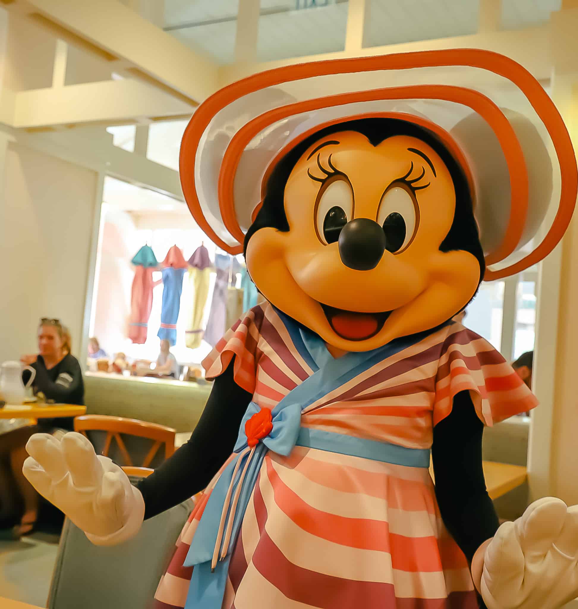 Minnie Mouse poses for a photo at the table. 