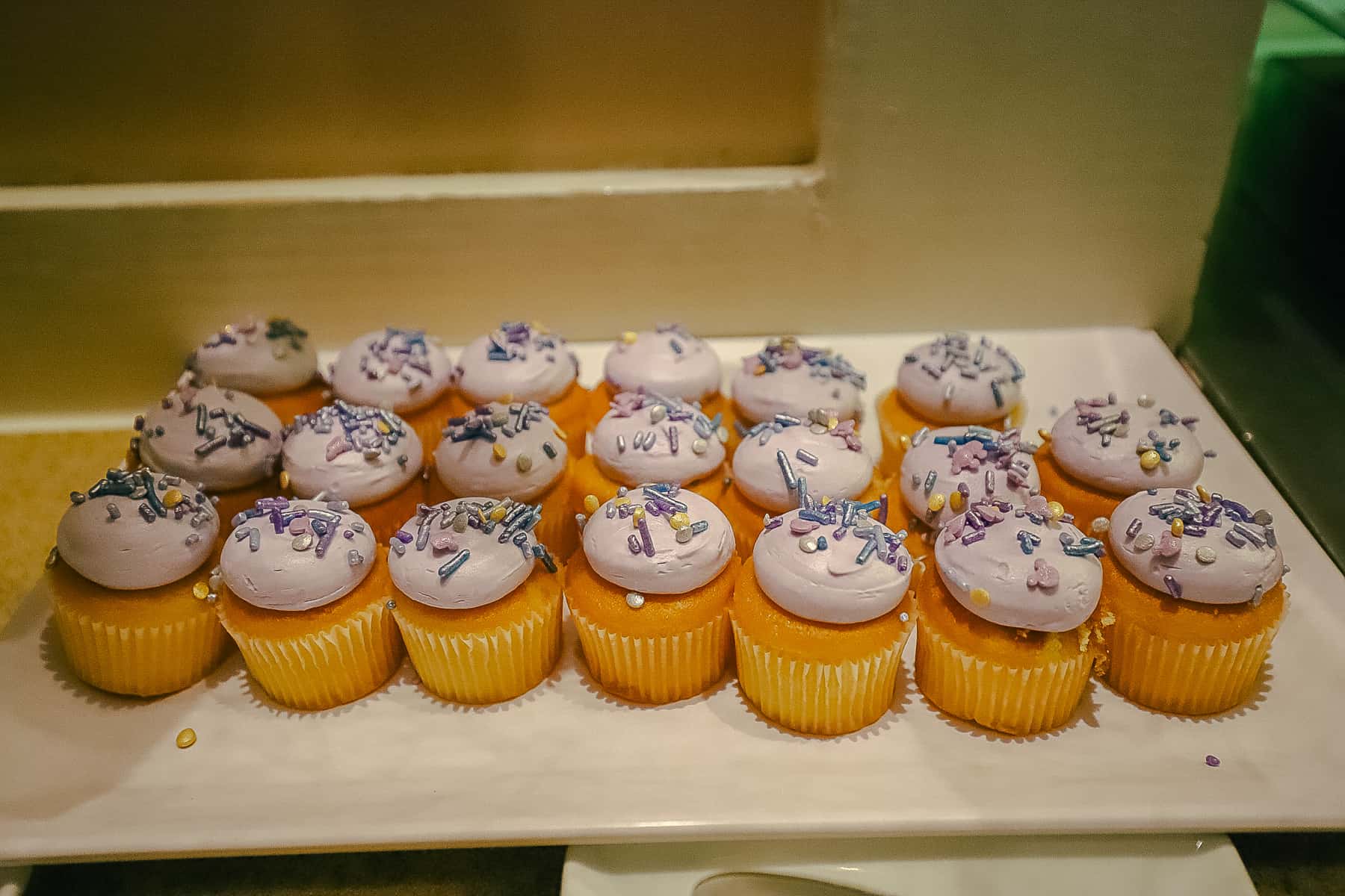 cupcakes with lavender icing and sprinkles 