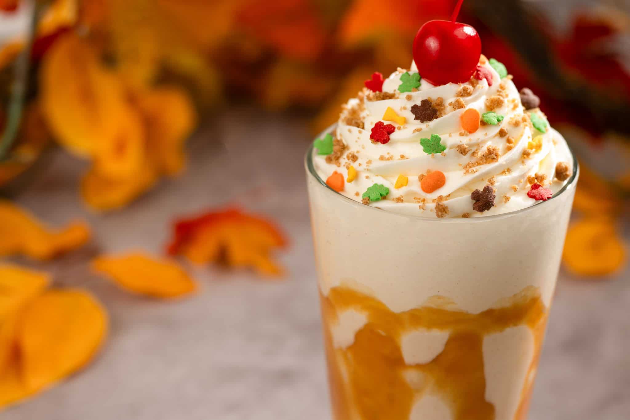 caramel pie shake topped with a cherry 