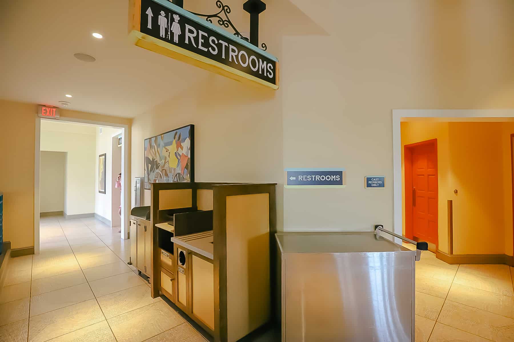 a sign that indicates where the restrooms are located at Centertown Market 