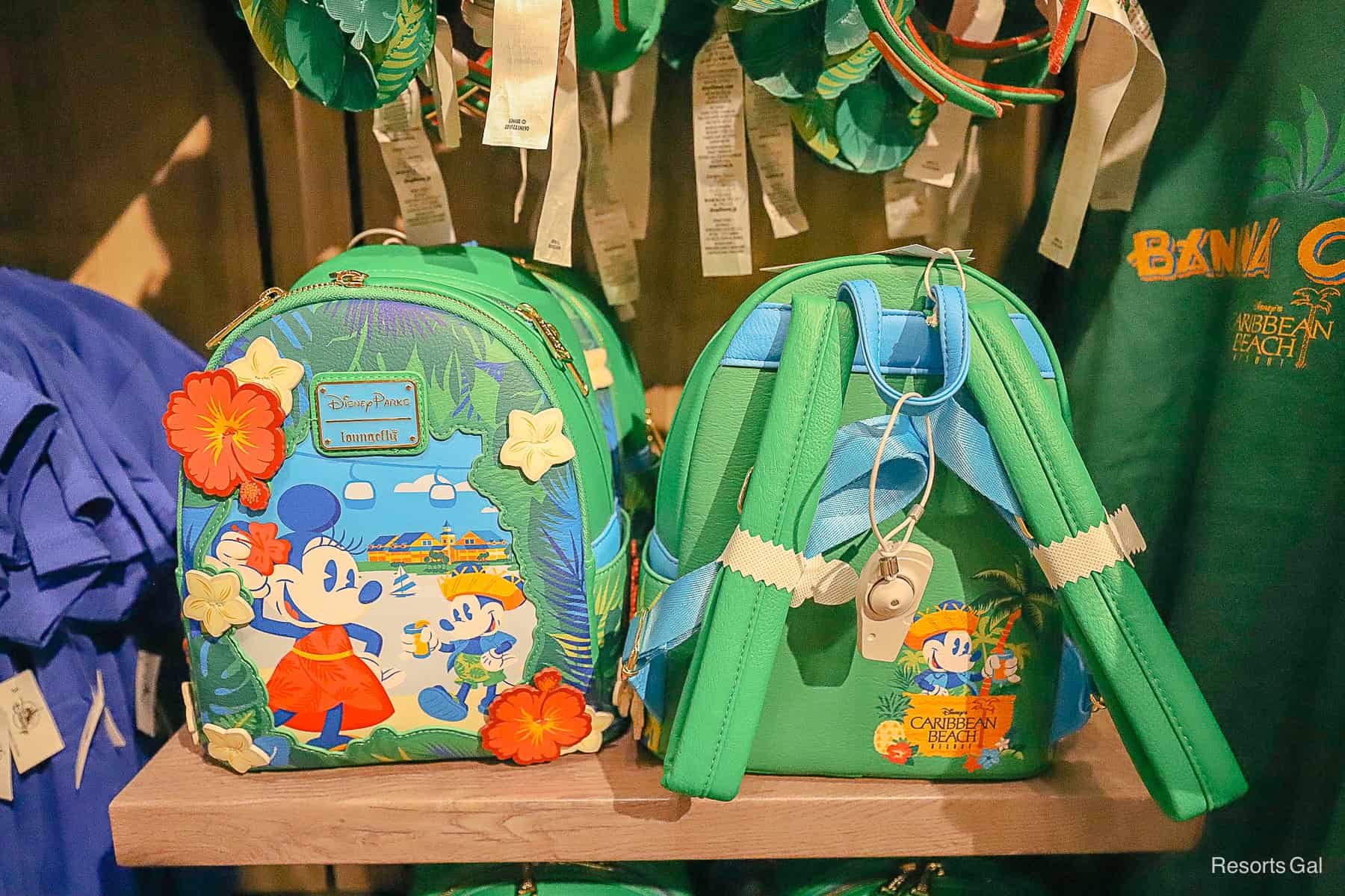 the front and back of a green Loungefly with Mickey and Minnie Mouse 