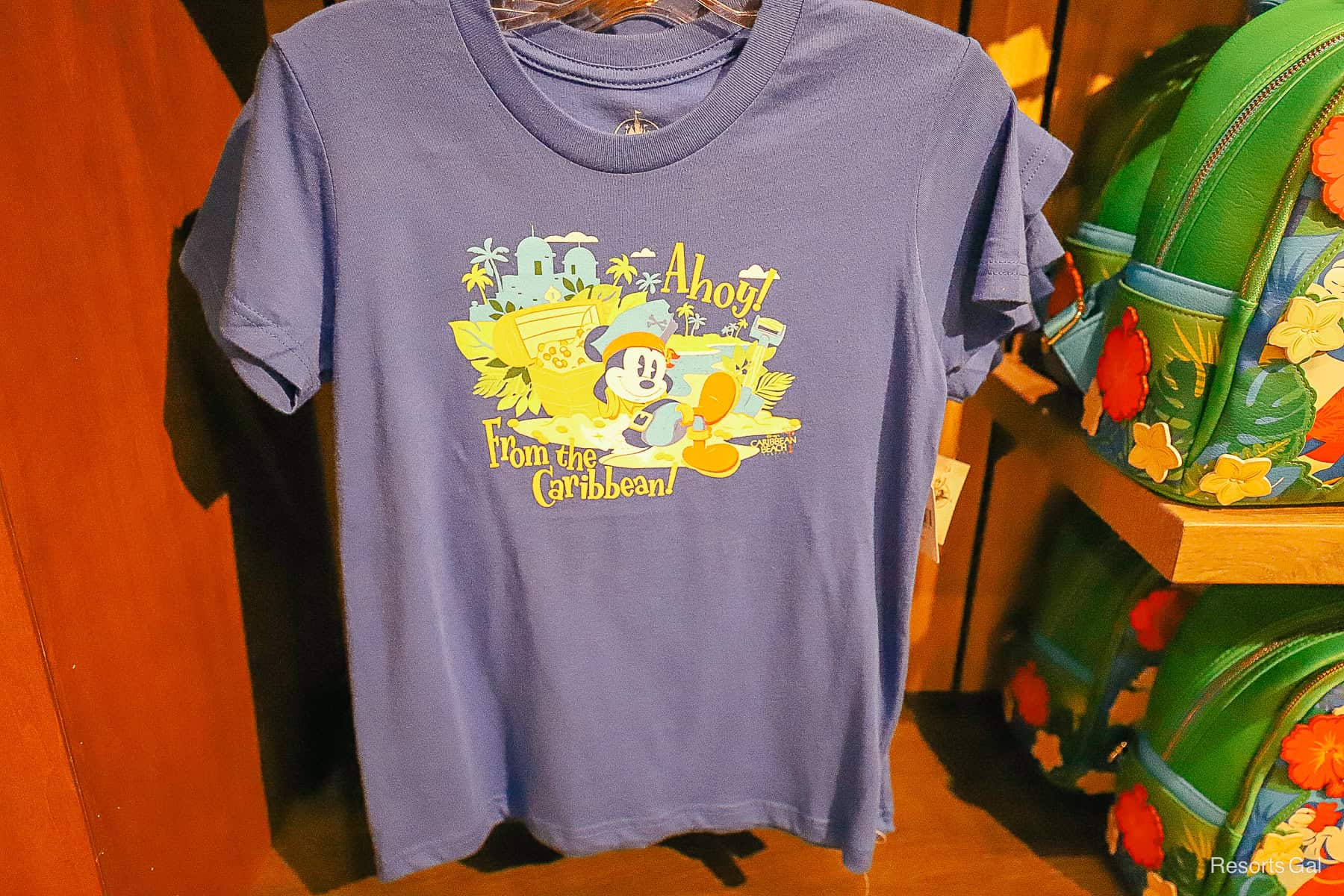 a shirt with Mickey as a pirate at the resort pool that says "Ahoy from the Caribbean" 
