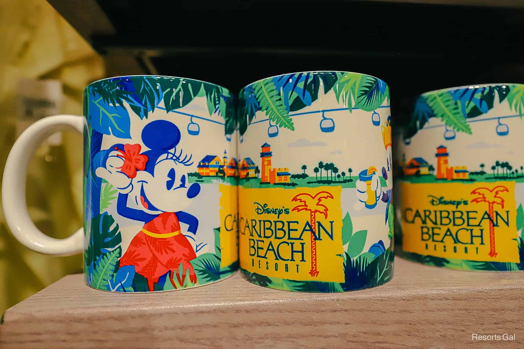 the front and back of a resort mug with Minnie Mouse 