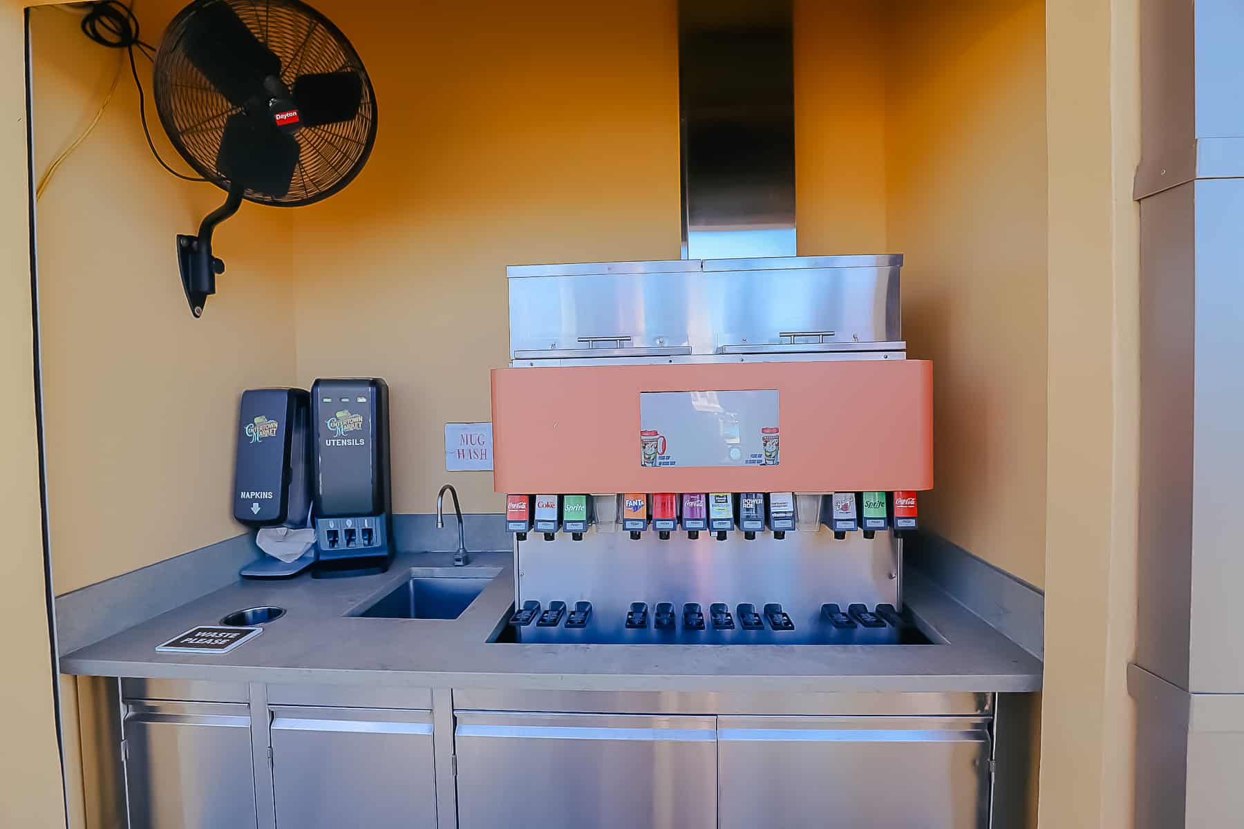 Soda refill station with a sink to wash mugs at Disney's Caribbean Beach. 