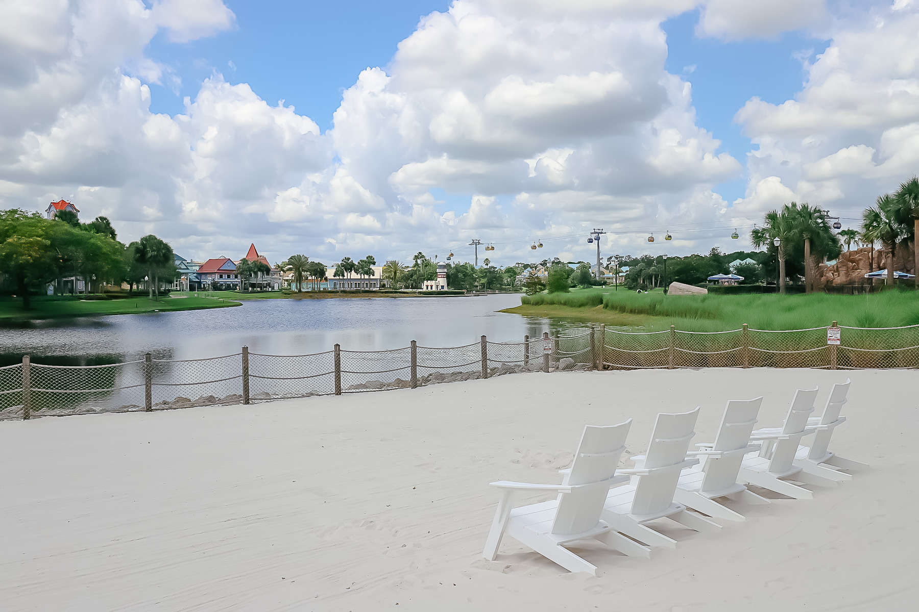 white sand beaches with chairs facing Barefoot Bay