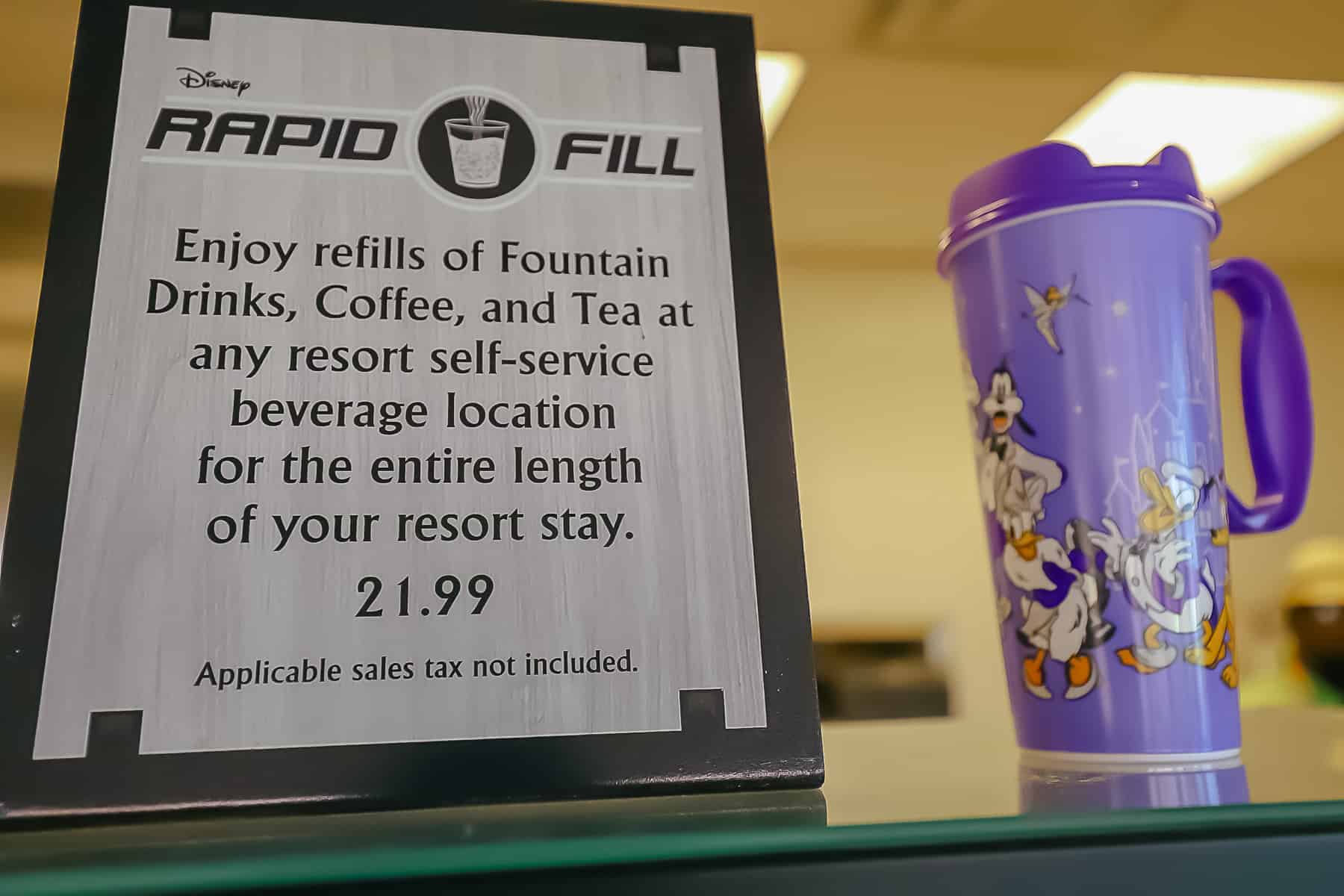 Rapid Fill mug with a sign that explains the process 