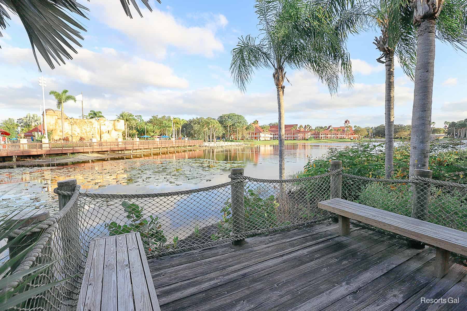benches on a wooden boardwalk that face the Barbados section of the resort