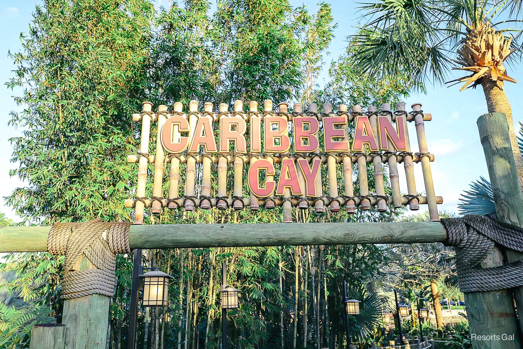 a sign with wooden letters that says Caribbean Cay