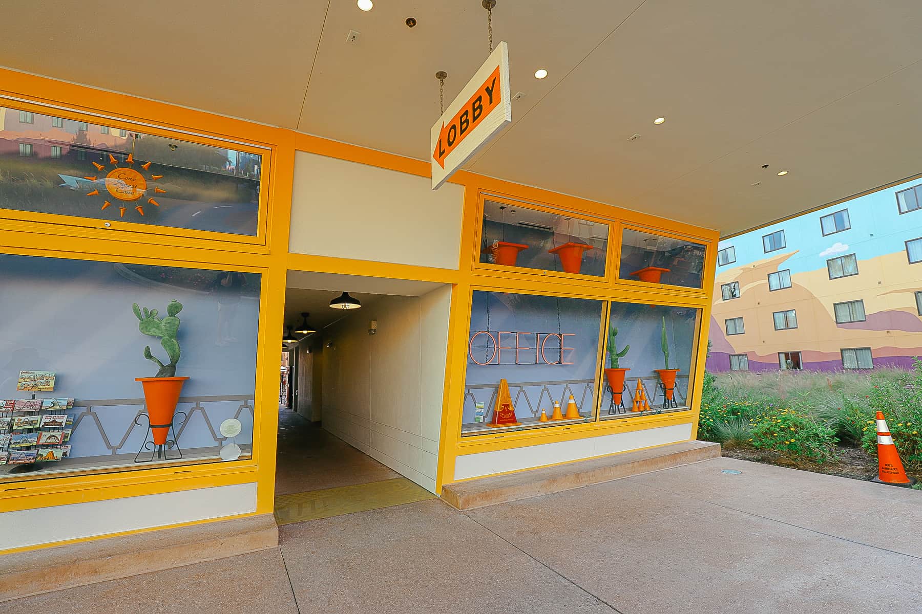 the pool's laundromat is themed to look like the Cozy Cone motel 