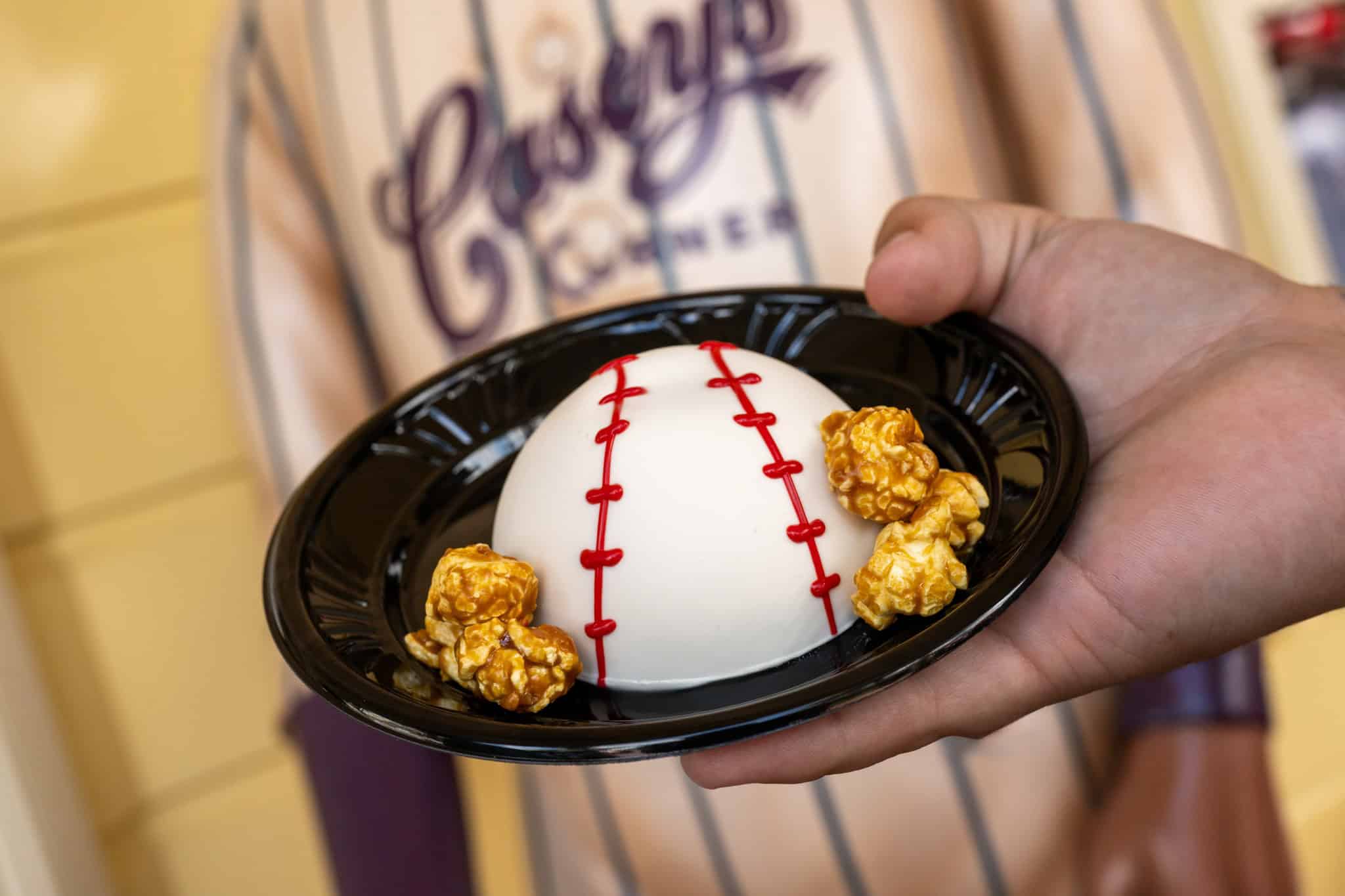 a plate with a baseball shaped brownie with white chocolate