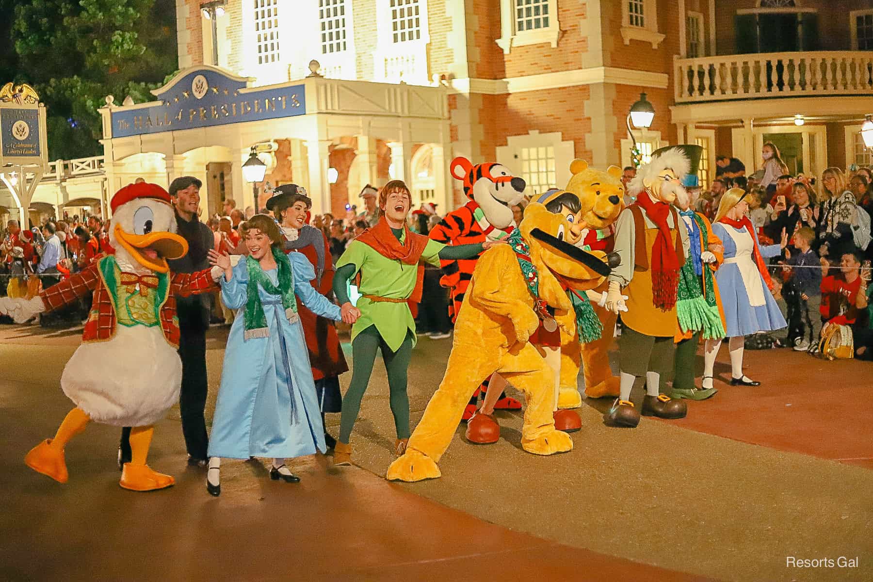 Characters like Donald Duck, Wendy, Peter Pan, Pluto and more kick off the Christmas Parade during the party.