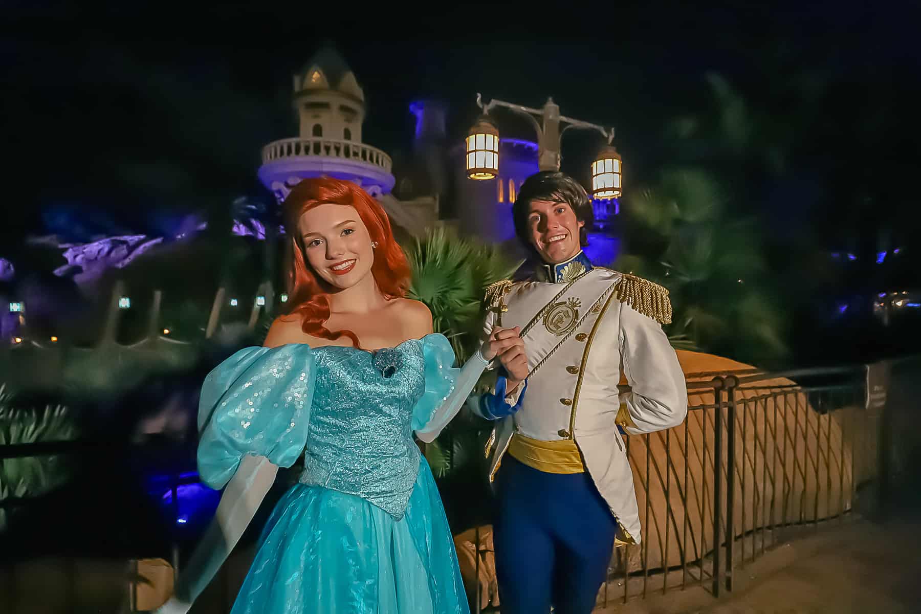 Ariel in her land dress with Prince Eric is his naval attire. 