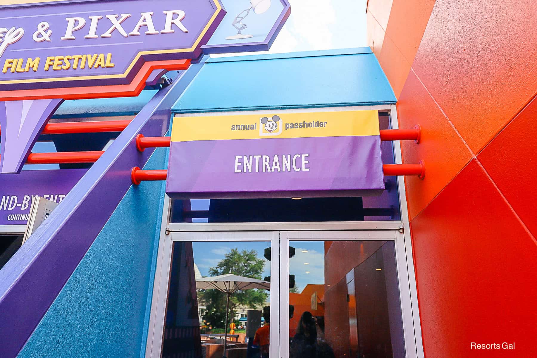 a sign over a door that says Annual Passholder entrance