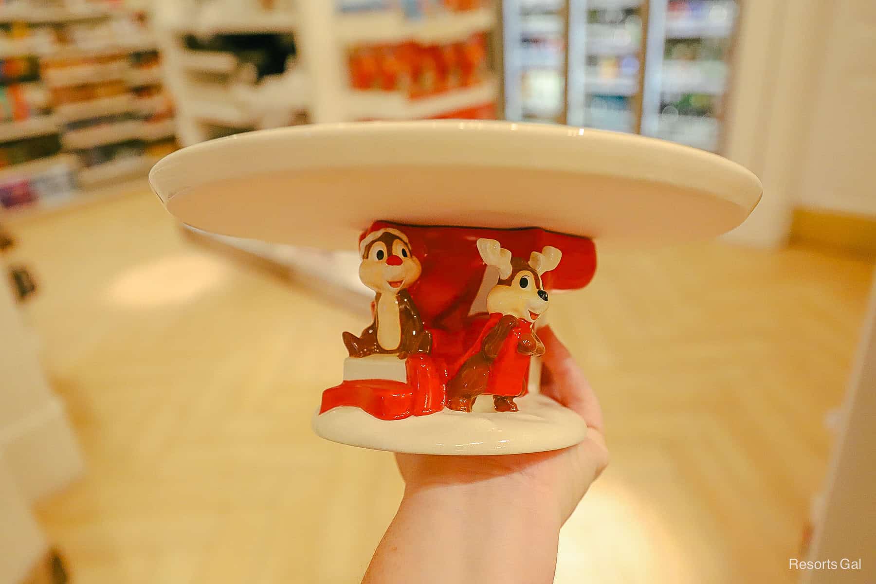 Chip and Dale at the base of a holiday cake stand.