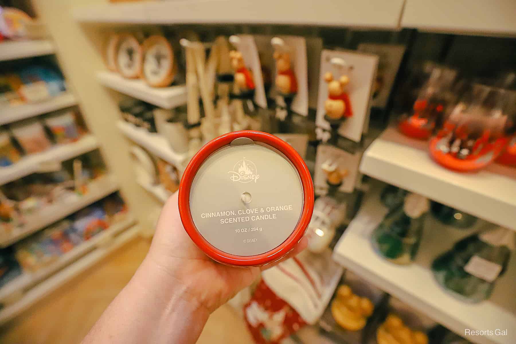 the label says Cinnamon Clove and Orange Scented Candle