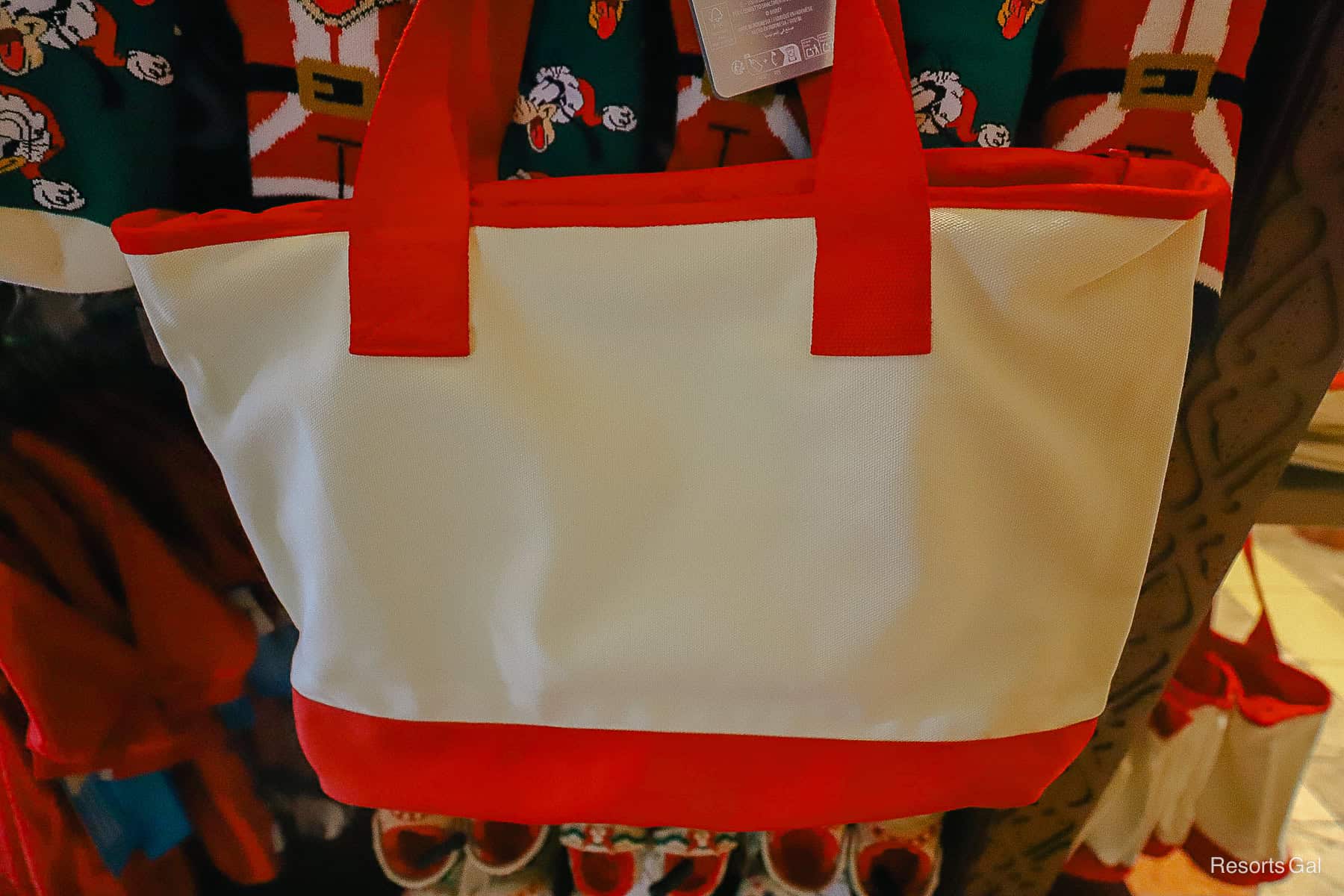 the back of the cream tote with red trim 