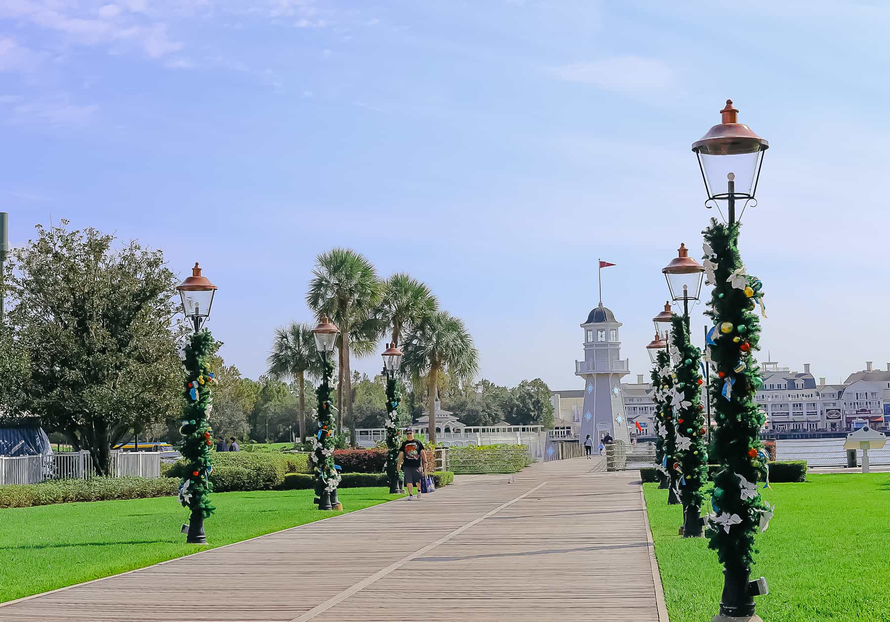 entrance to the Yacht Club with light poles wrapped in garland