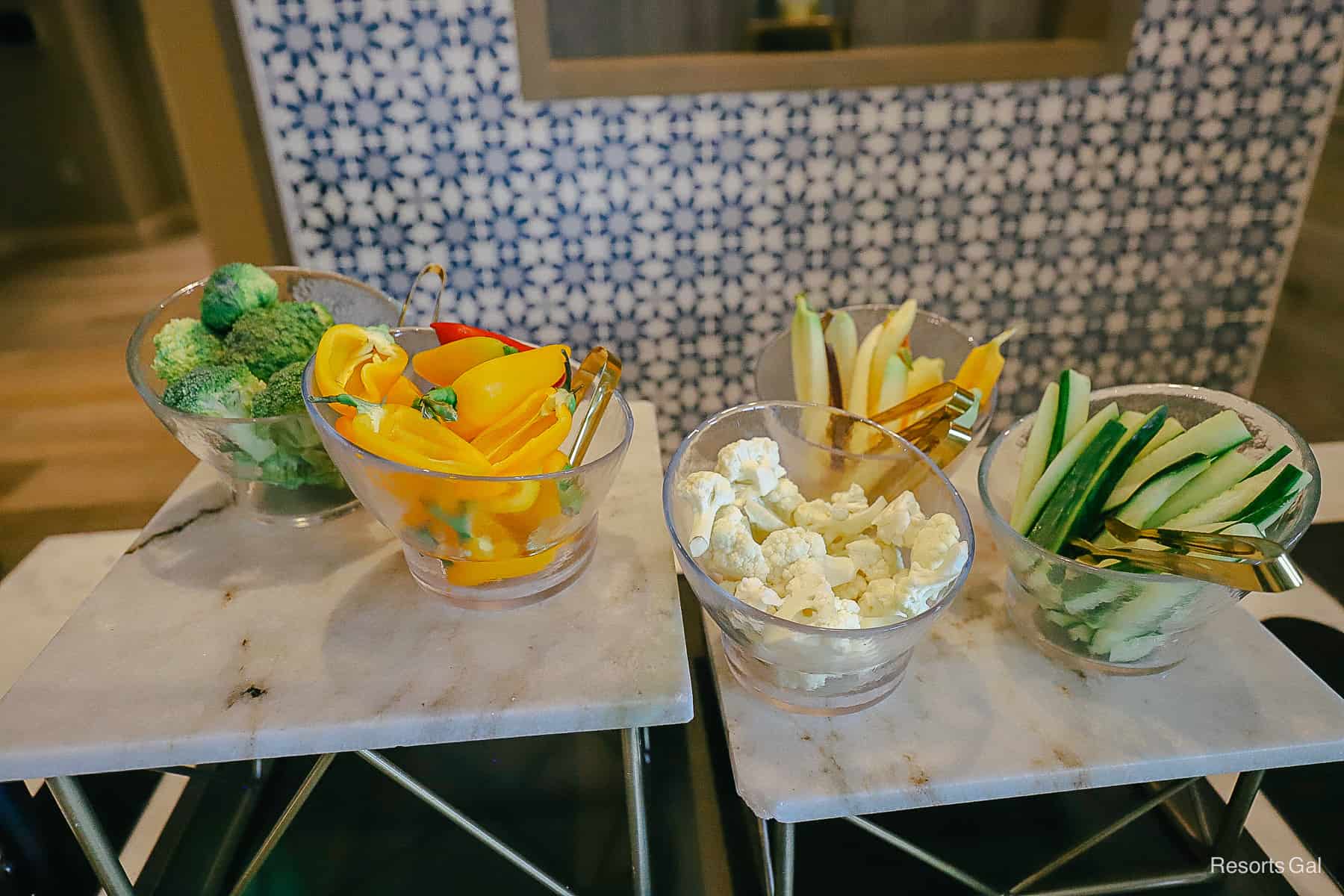 dishes with broccoli, peppers, cauliflowers, zucchini, and rainbow carrots 
