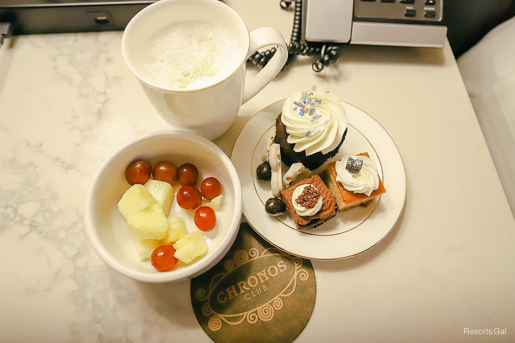 a prepared plate with desserts and fruit 