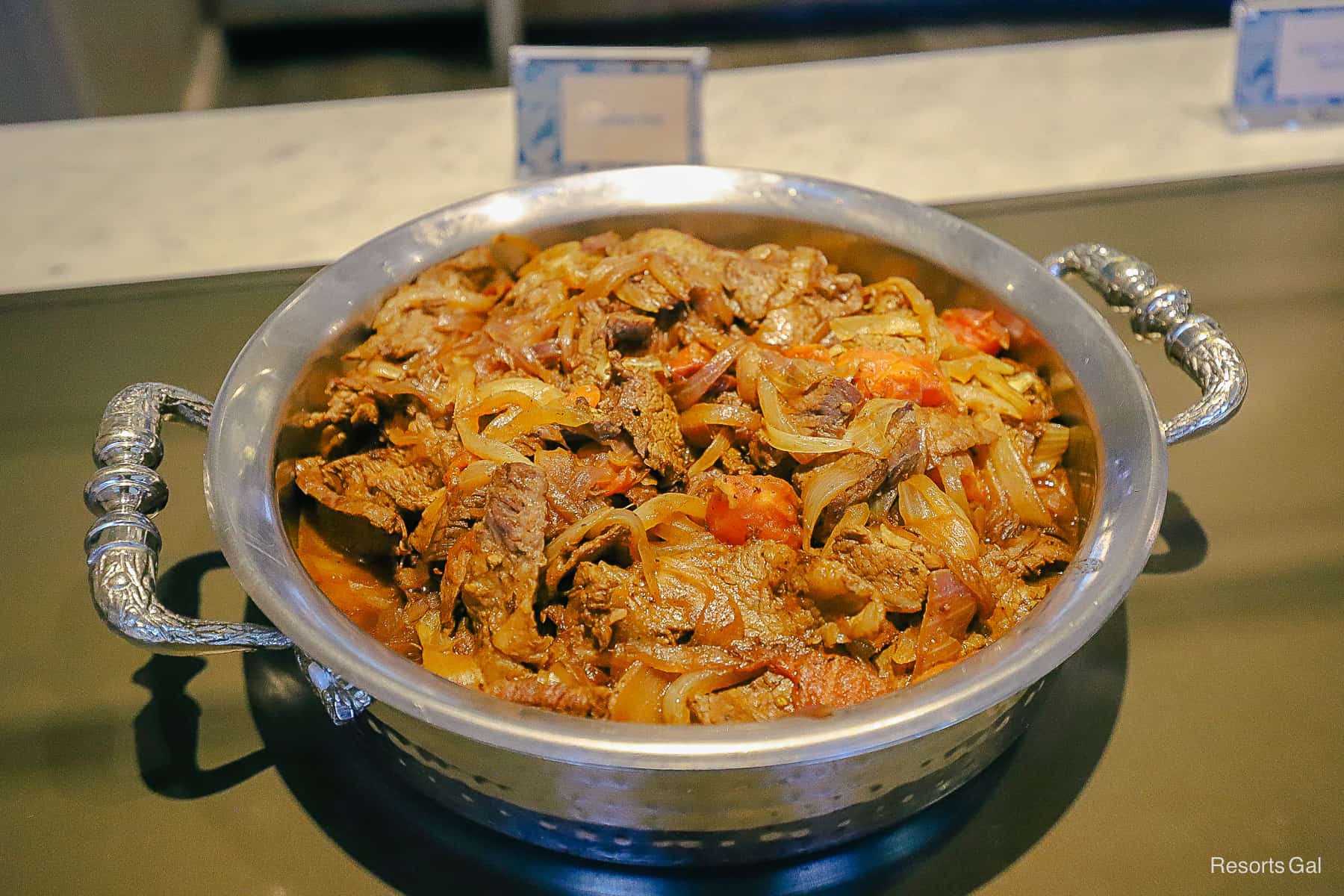 a large platter with roast beef 