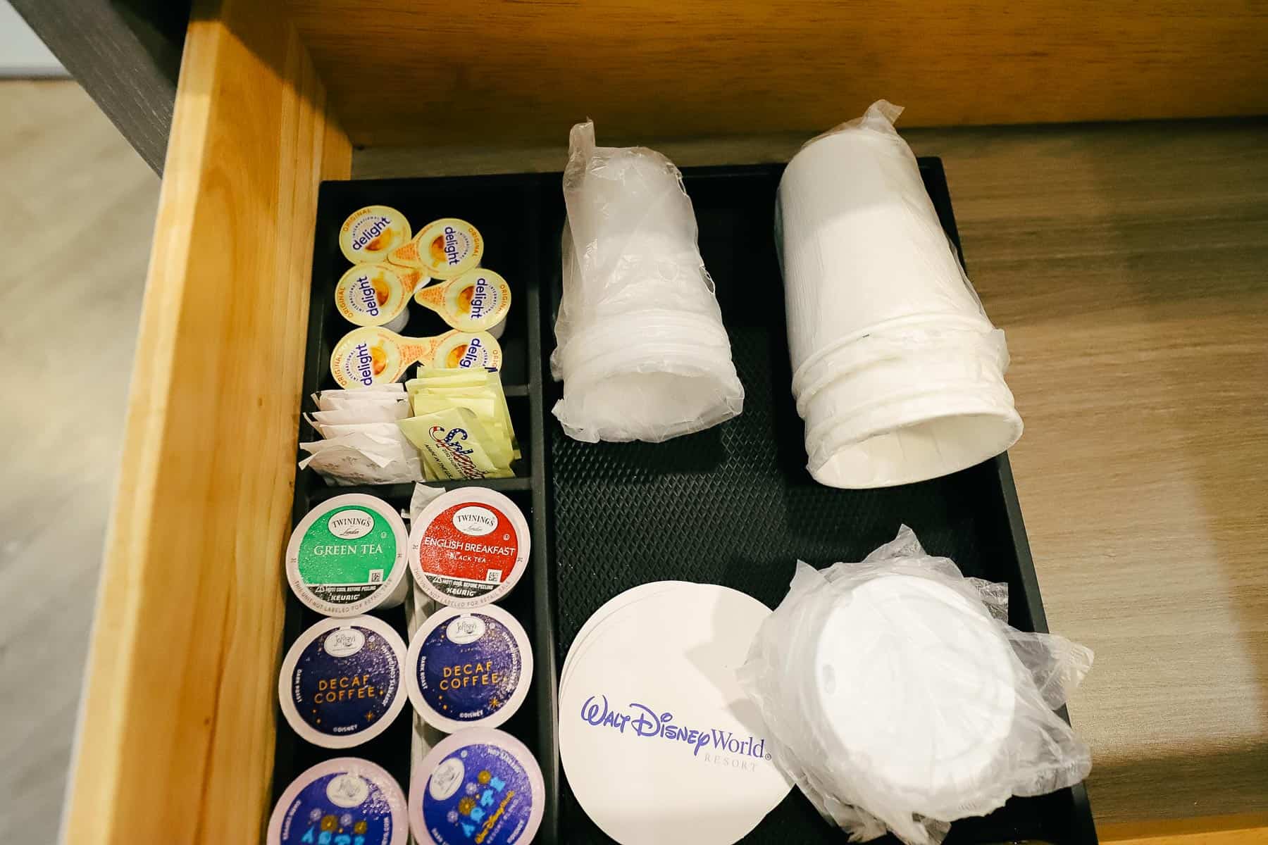 Coffee creamer, sweeteners, and cups provided in the room. 