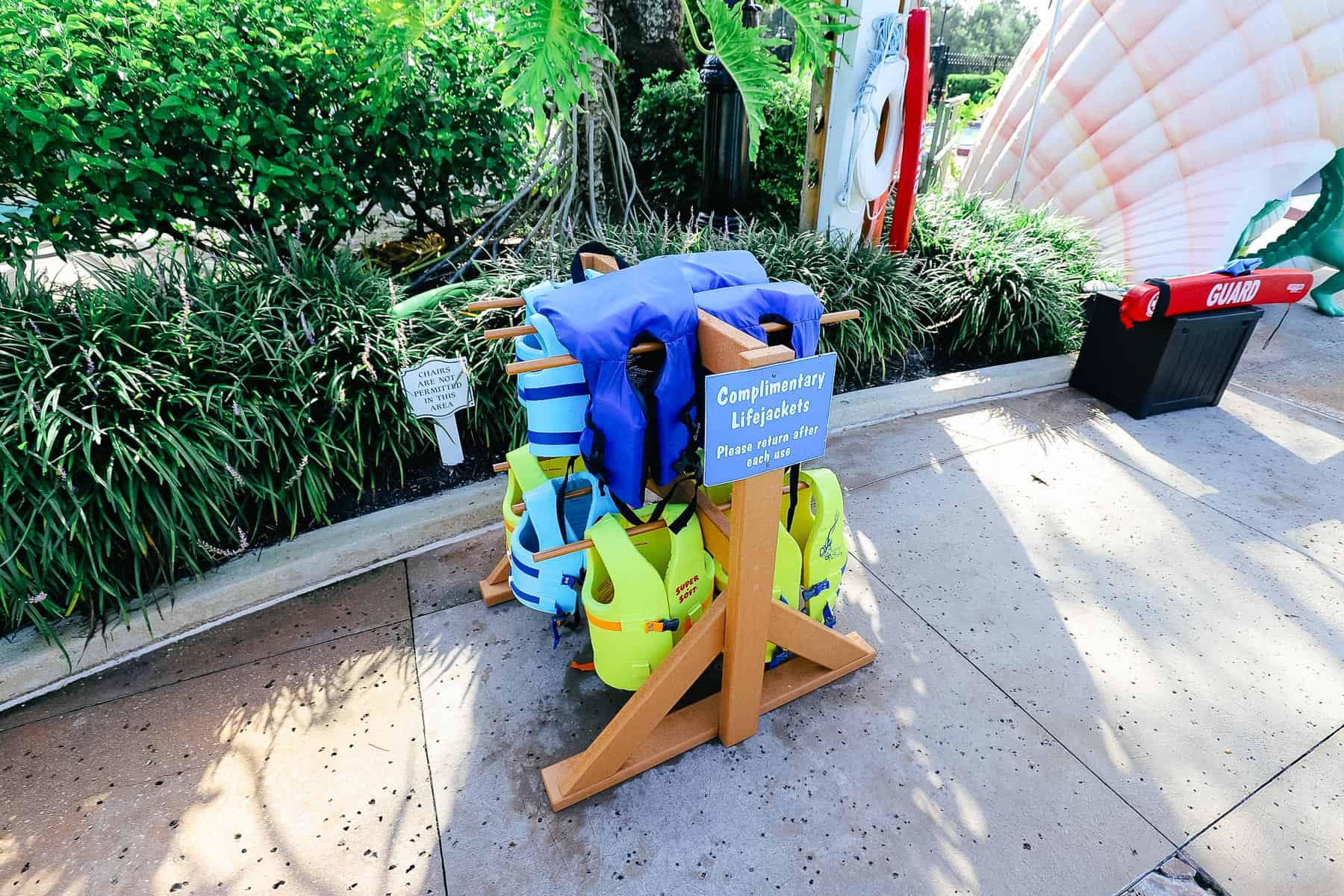 a stand with complimentary life jackets at Port Orleans French Quarter Pool 