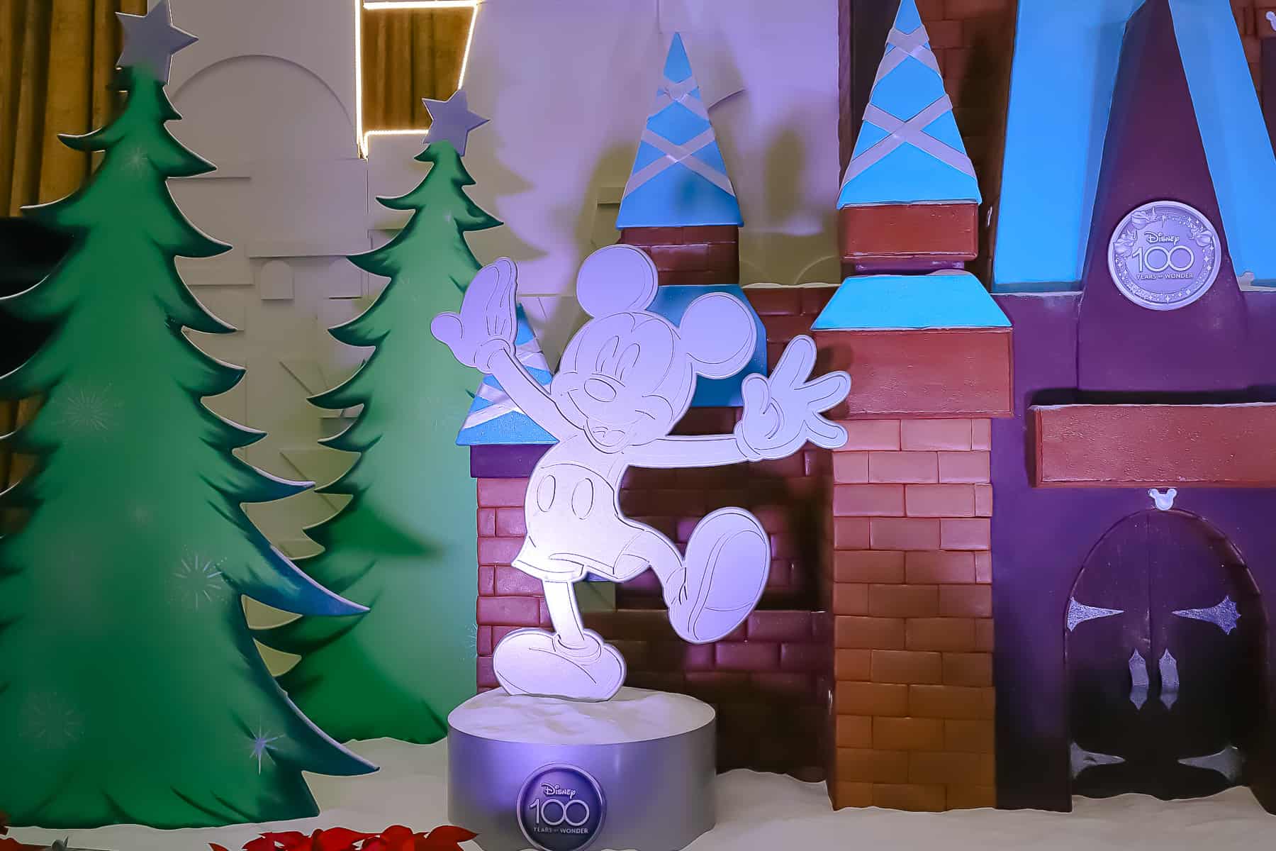 zoomed in view of Mickey with a Disney100 emblem