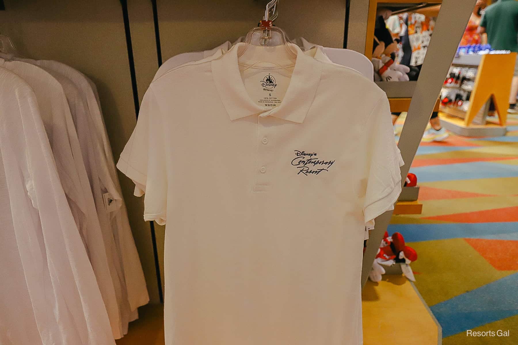 a white polo shirt with the resort logo