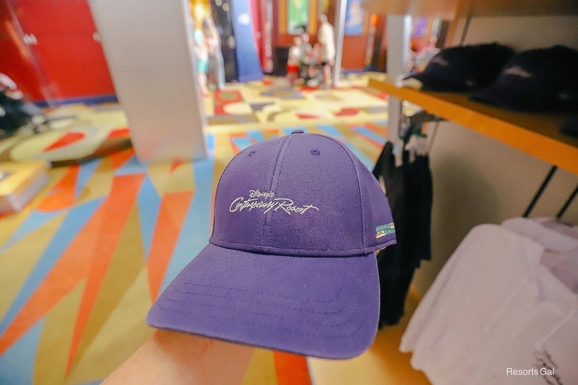 a navy blue ball cap with the Contemporary Resort logo